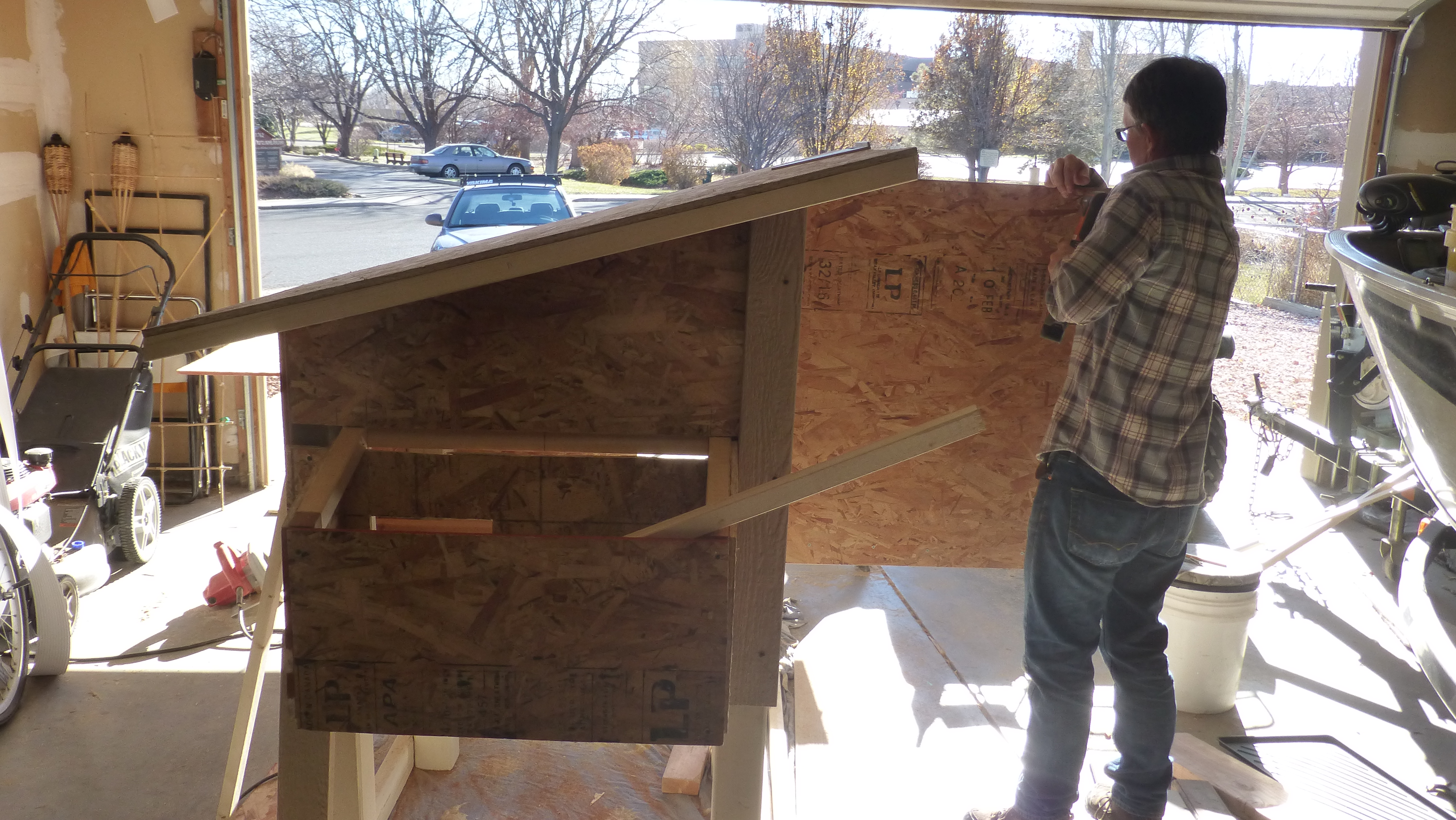 Brother-in-law (carpenter) helping us learn how to build a coop
