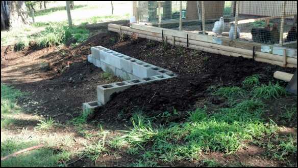 Building the retaining below the run. Temp fence is up in the run. Trying to find more reclaimed lumber to start on the perminent one. Gotta love Craigslist all those cinder blocks, landscaping timbers and 4x4 posts were free.