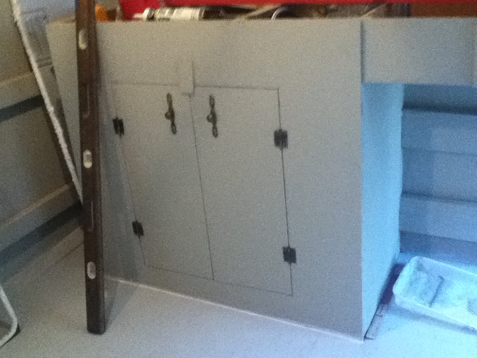 Cabinet for feed and supplies, located under the nesting boxes