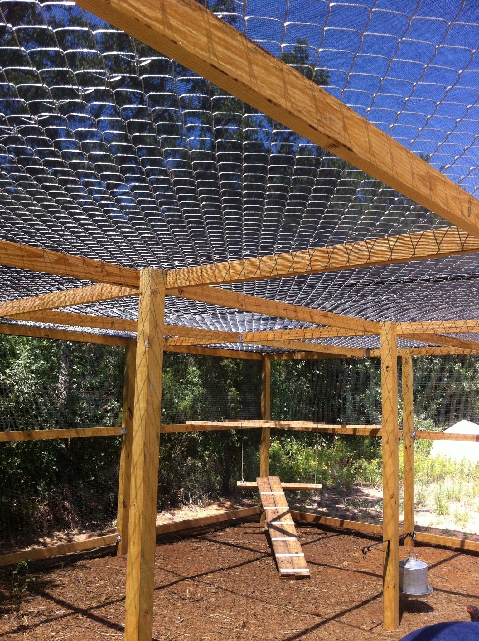 Chain link fence put on top, we added a cool shade tarp that covers the entire top.  That help tremendously with the intense Texas summers