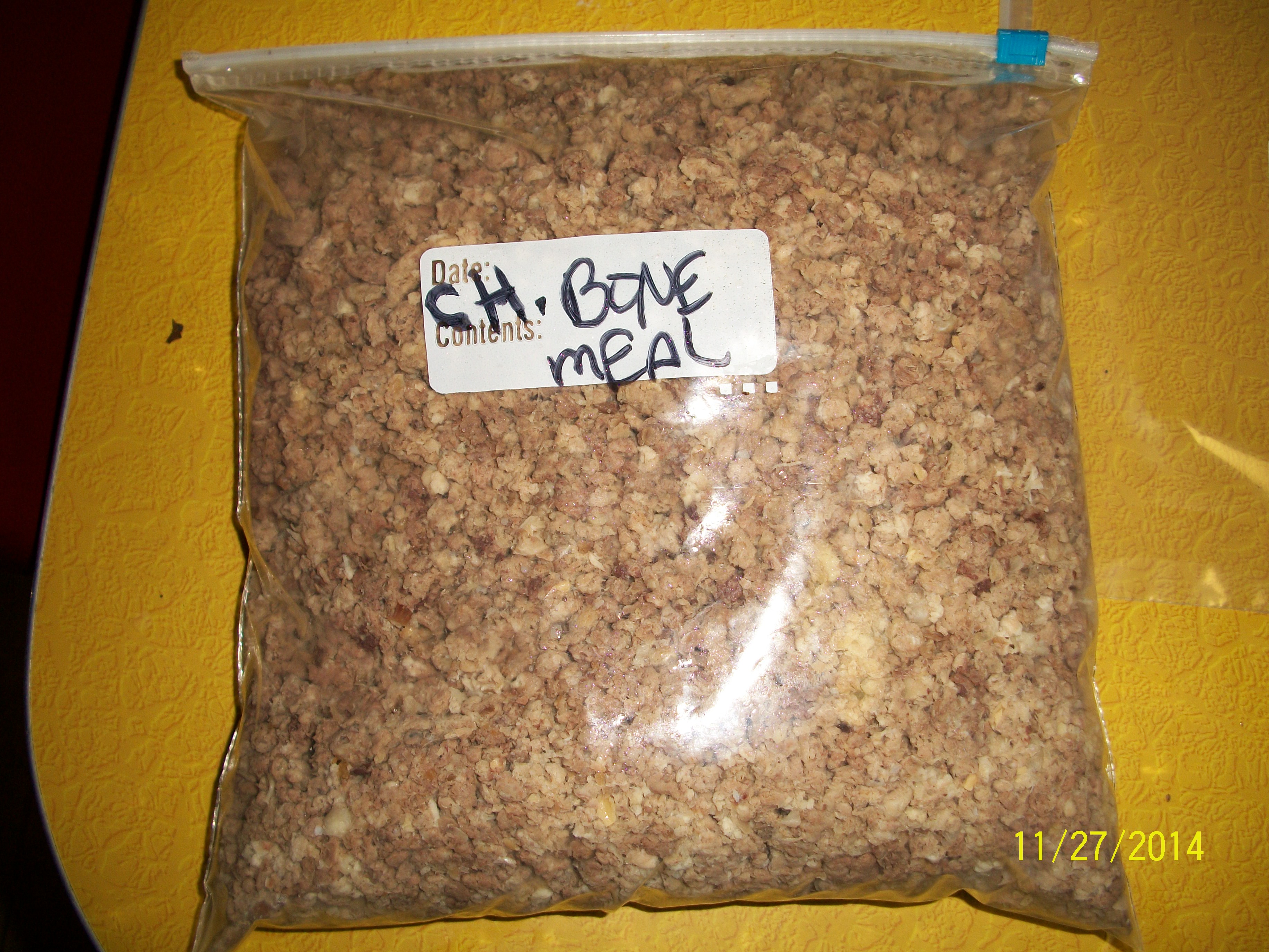 Chicken bones, organs and some meat ground down and stored to be used for feeding to chickens in breeding season.