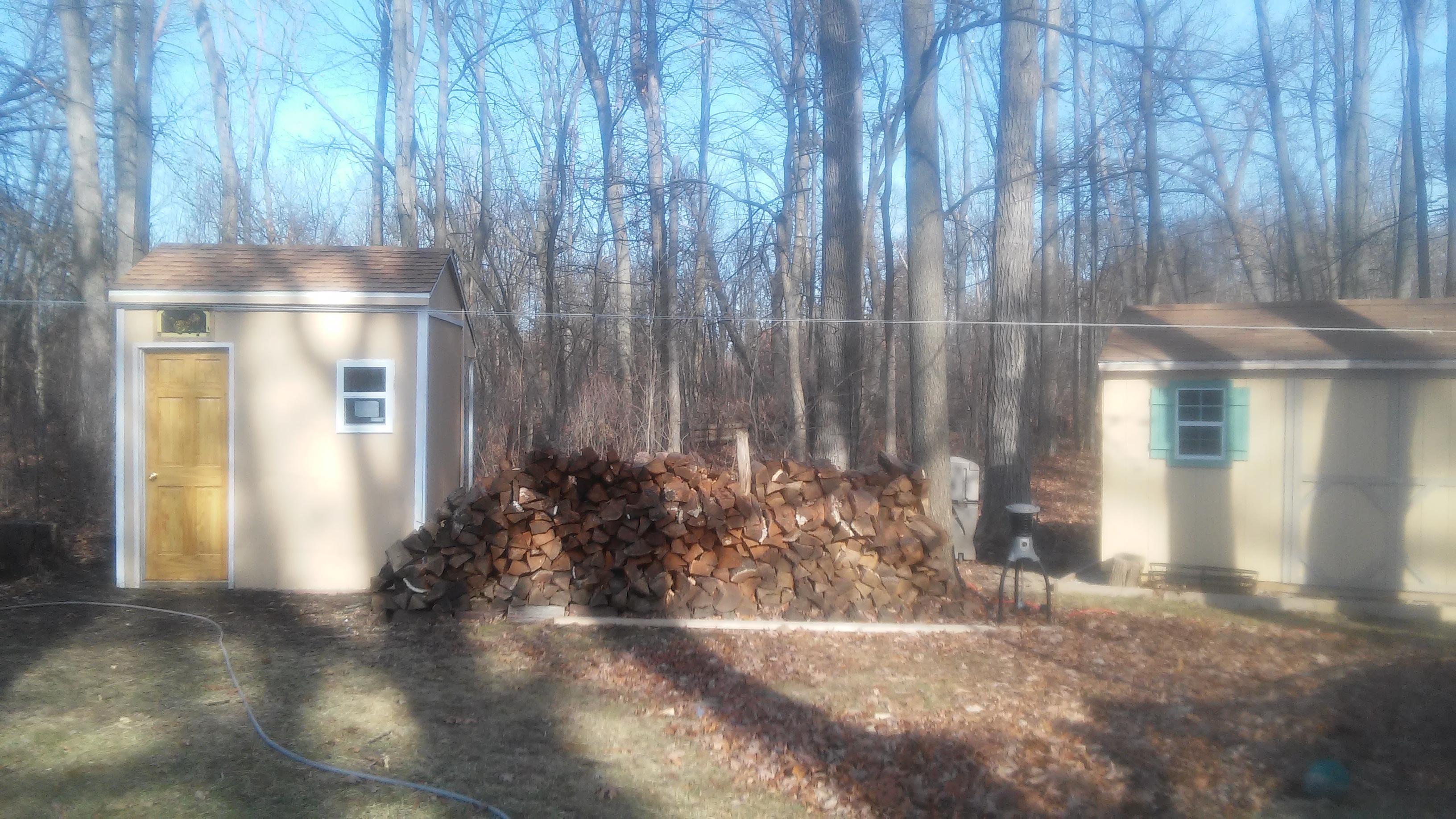 Chicken coop is on the left, Shed is on the right. This spring I plan on adding little green shutters to match the shed.  In case you were wondering, Yes that is a stain glass window above the door.