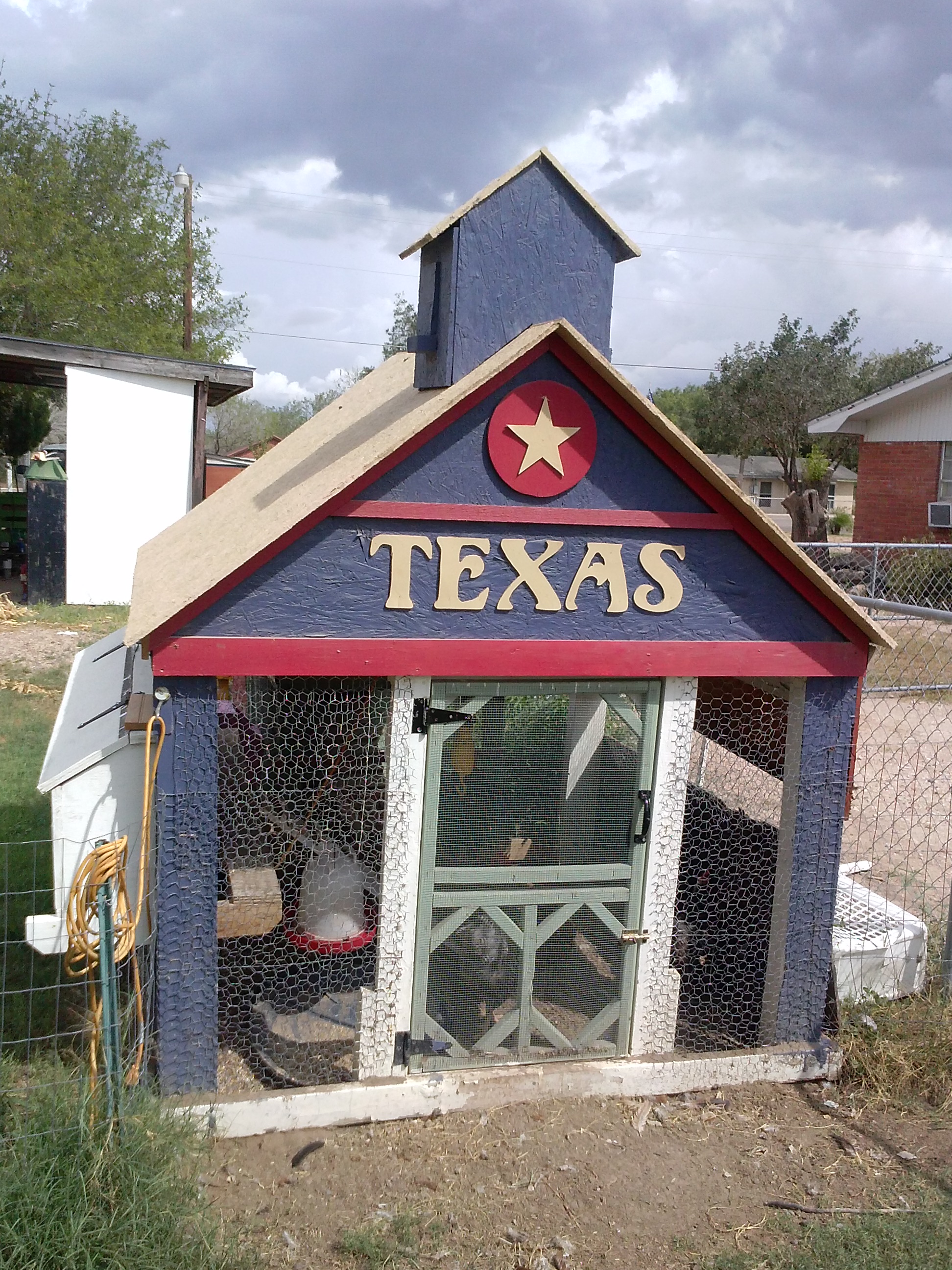 Chicken coop was done with recycled wood and left over paint. Penitas, Texas. Letters are cut from 1/4 inch plywood.