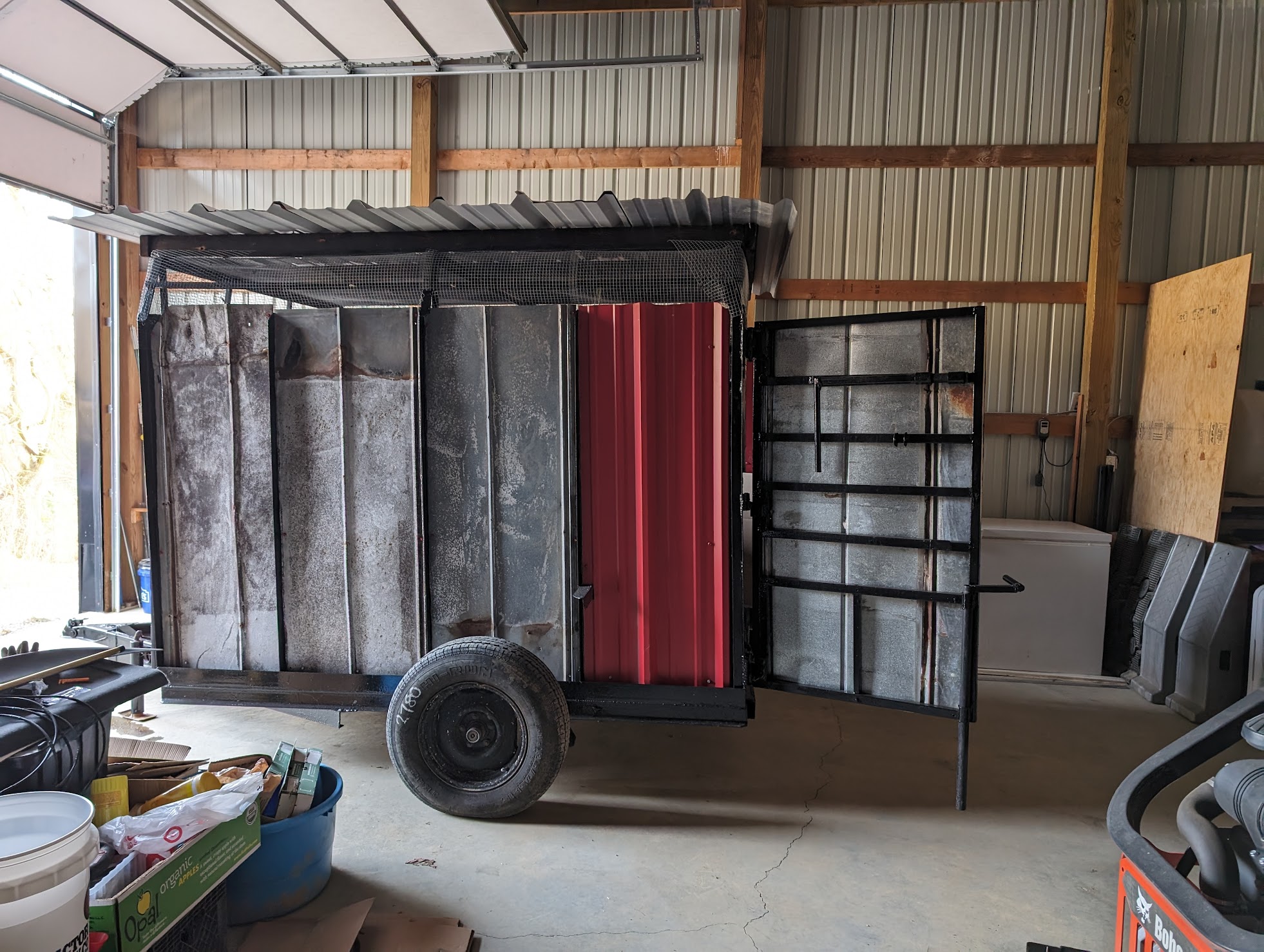 Chicken trailer in brooder mode, in our shop building ready for chicks