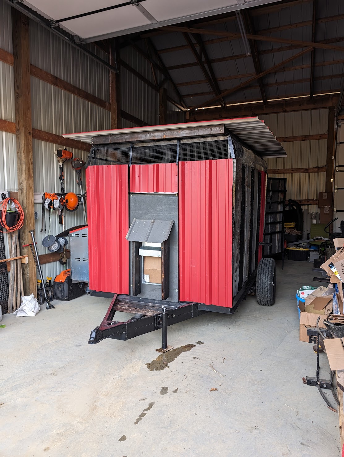 Chicken trailer in brooder mode, in our shop building ready for chicks