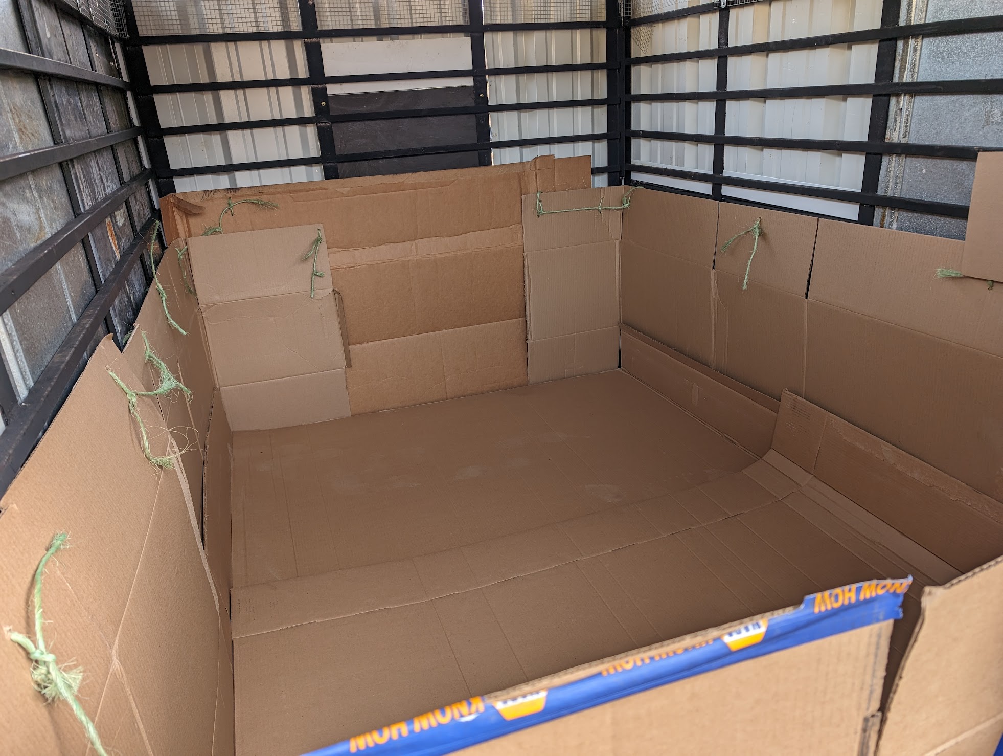 Chicken trailer in brooder mode, in our shop building ready for chicks