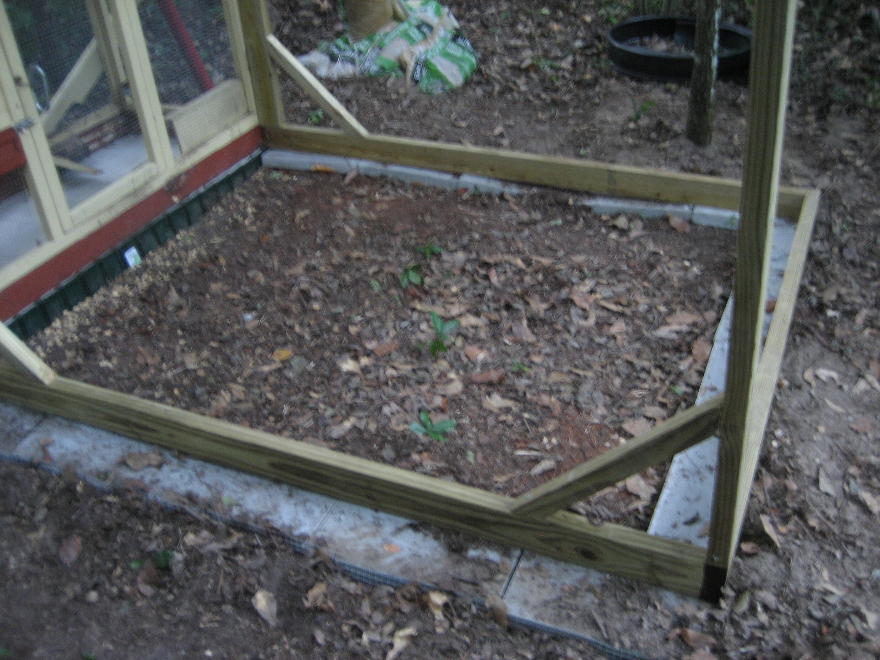 Closer view of the frame on the blocks. He leveled out the ground with lots of rocks for drainage.