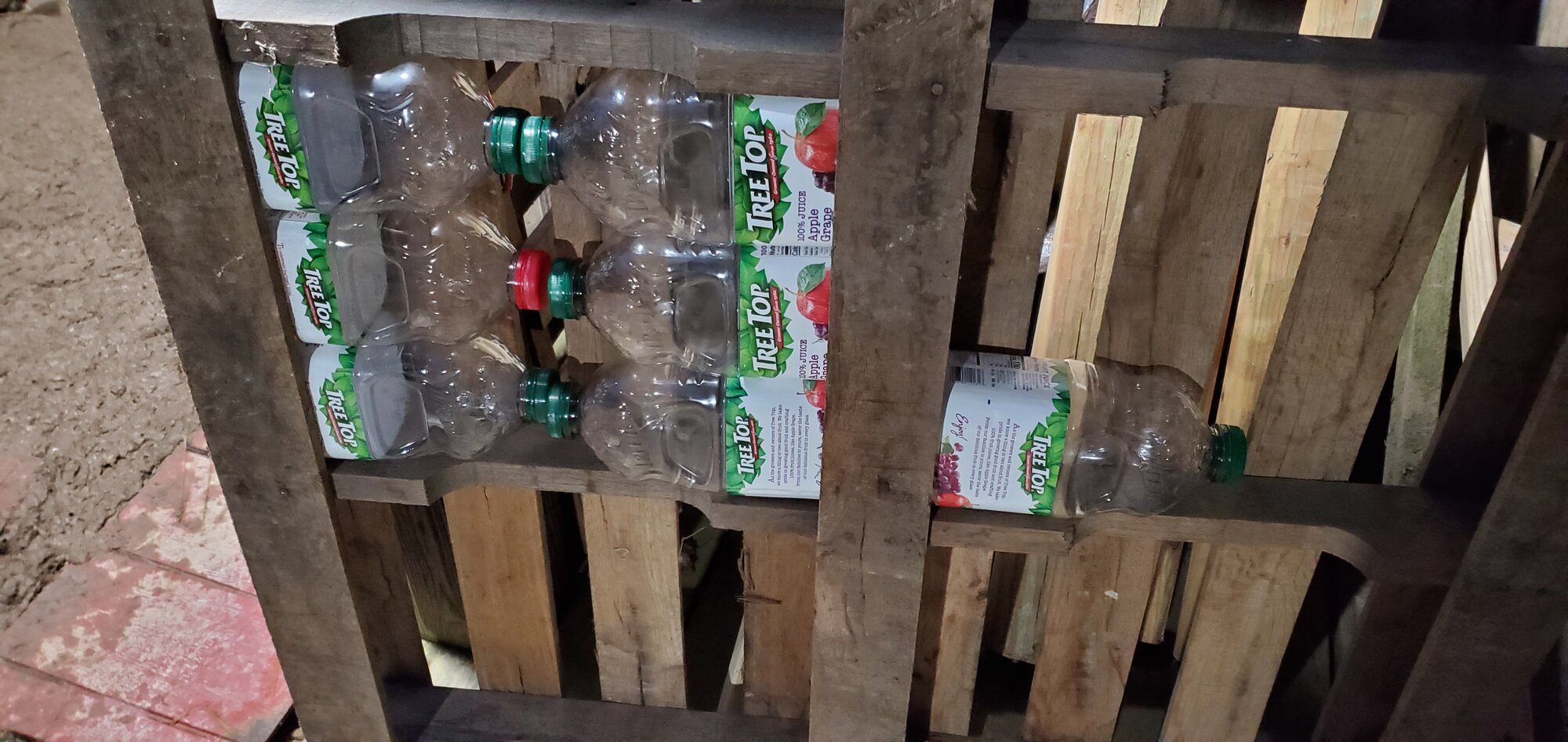 Closeup picture of the juice bottles in he pallet