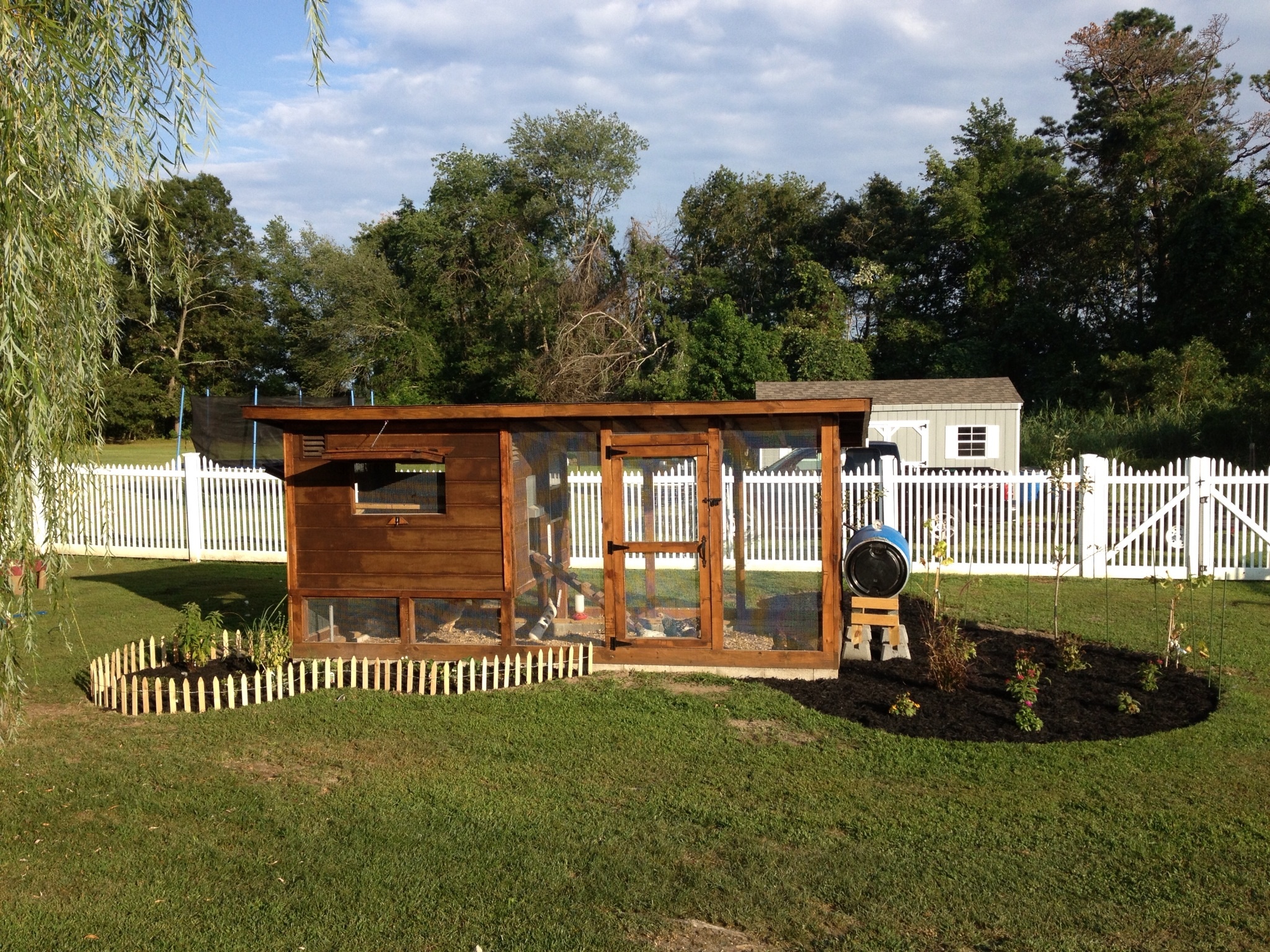 Completed landscaping  project, Herb garden' strawberry patch, blueberry bushes,grape vines, and a pair of apple trees.