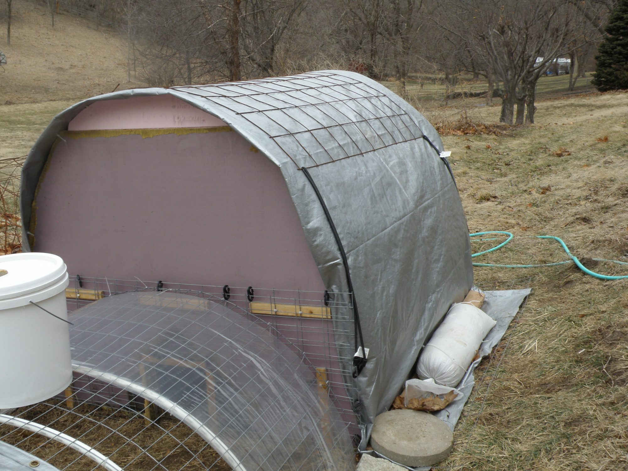 Coop cover with wind fly, tarp and tension stays -
PEX reinforcement watering section