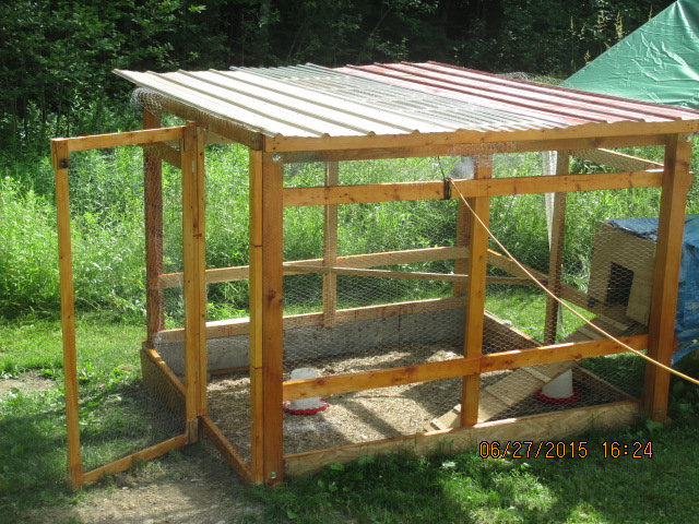Coop stained and waterproofed with Cabot Natural cedar Stain/waterproofing. Corrugated metal and plastic roof. Center is corrugated plastic to act as sunlight when sun is high in the summer.
