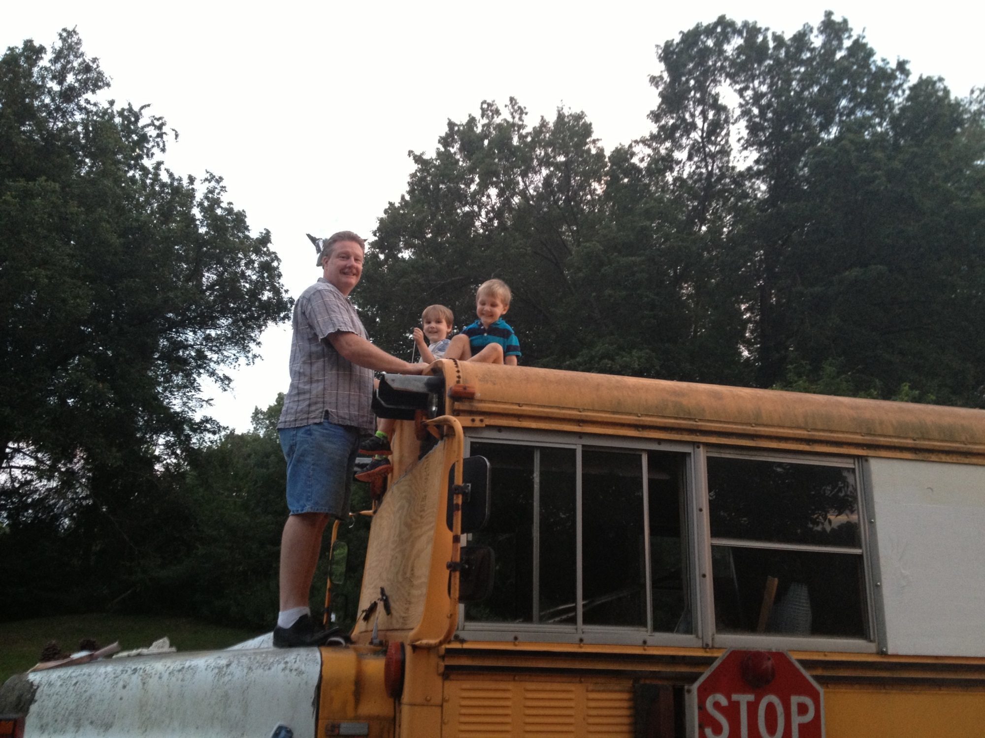 Daddy and boys putting wood in front window for me.