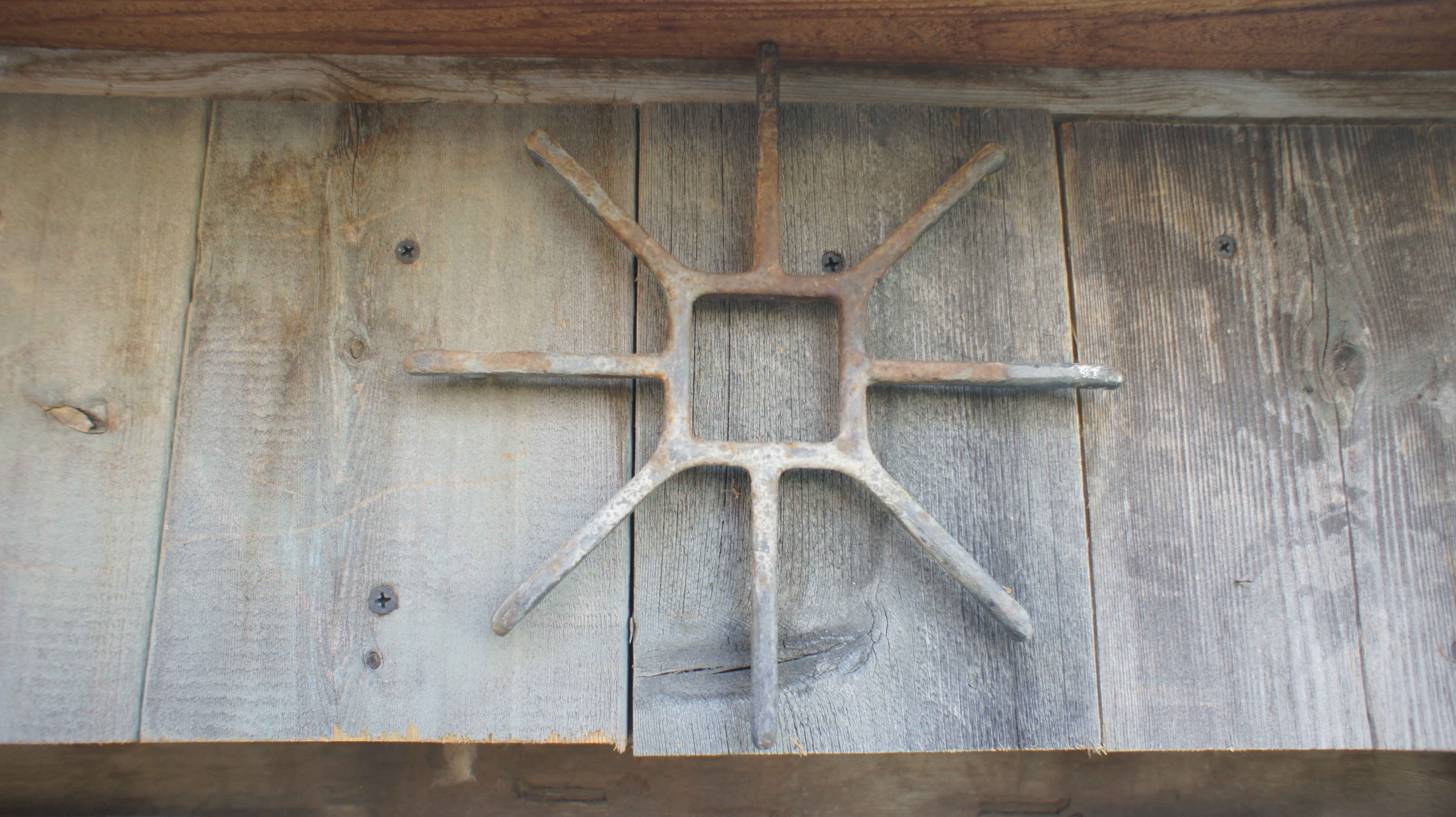 Decoration found in an old building- was once a gas stove top.