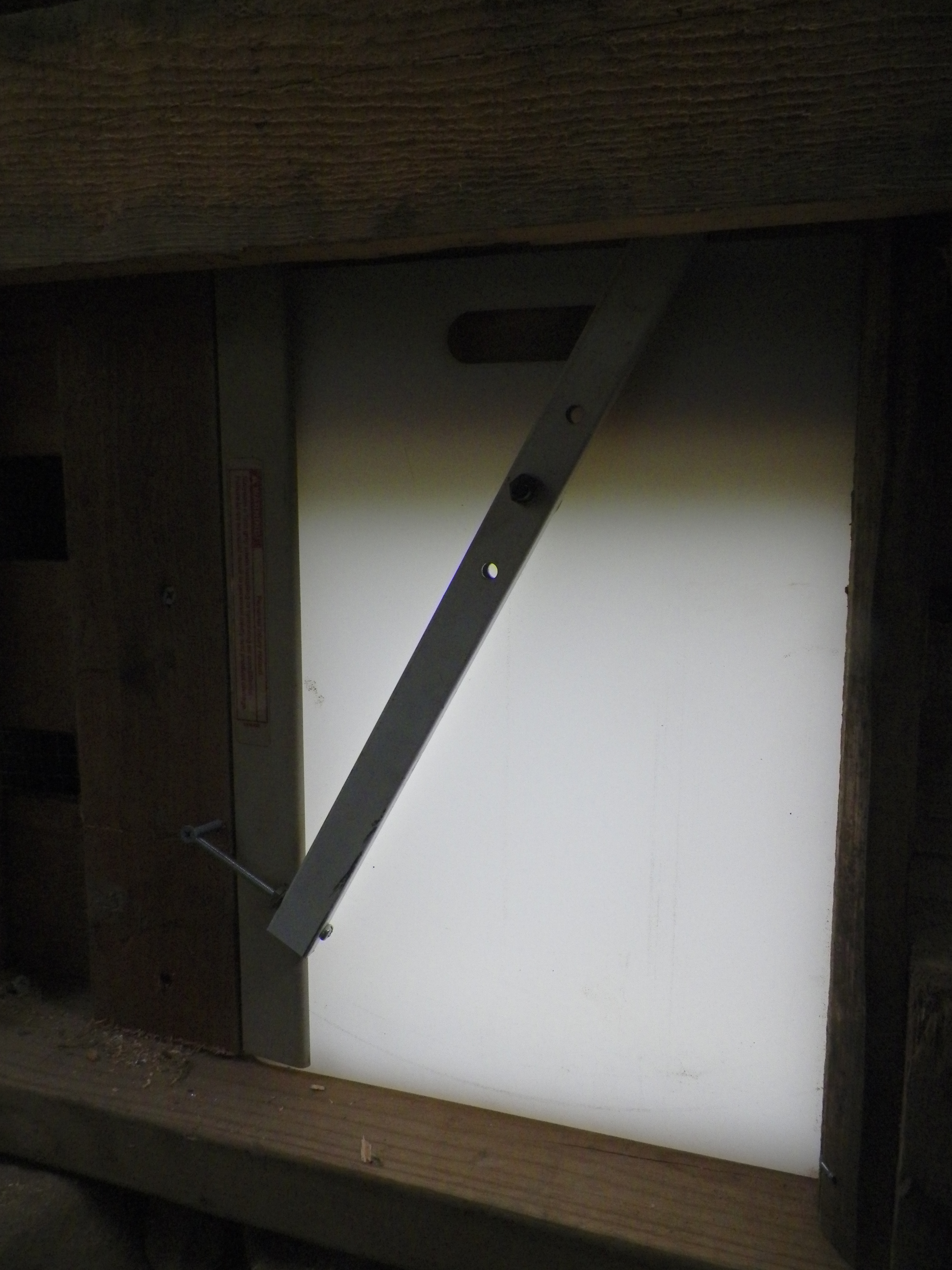 Detail of self latching coop door.