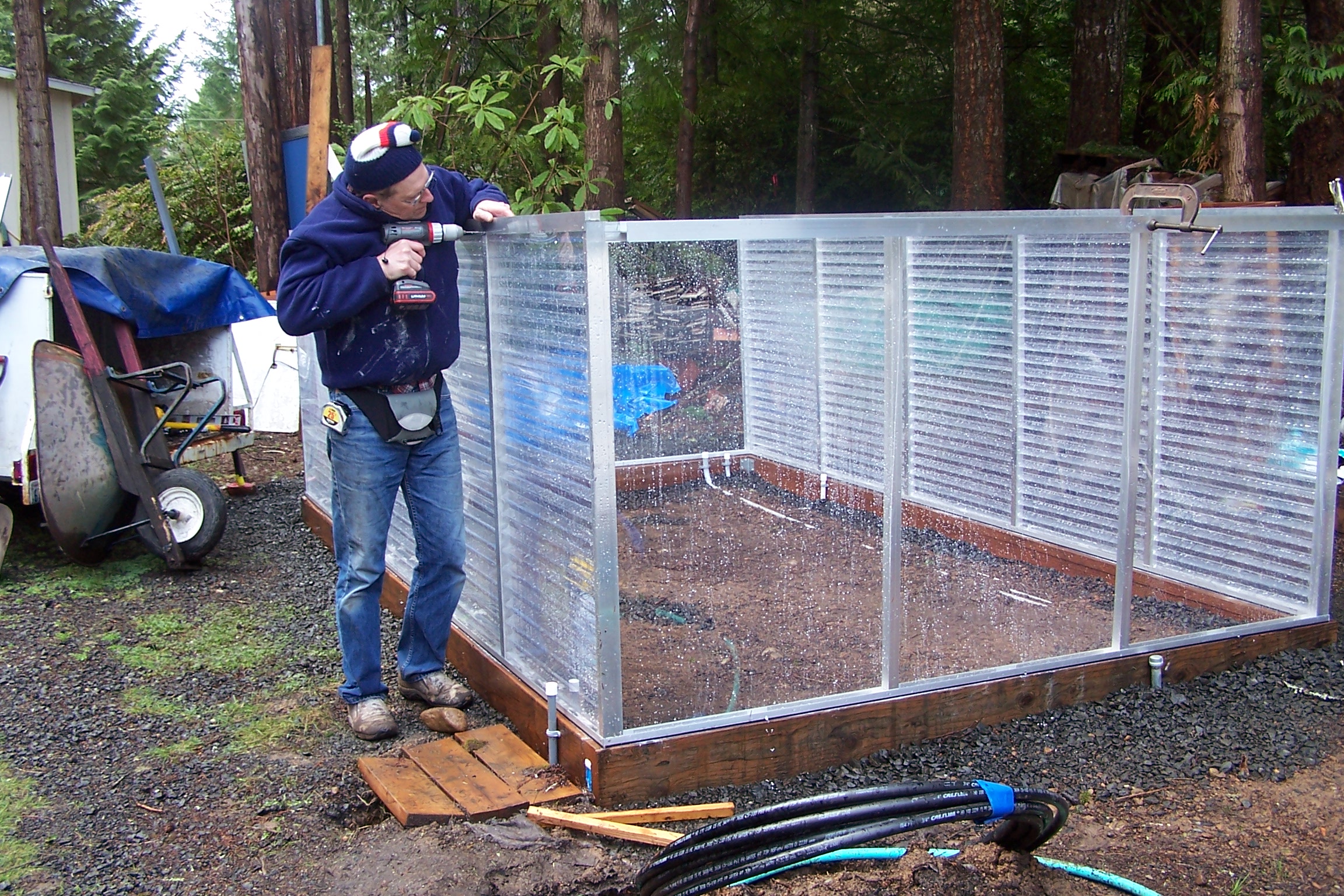 DH building the greenhouse in Spring of 2012