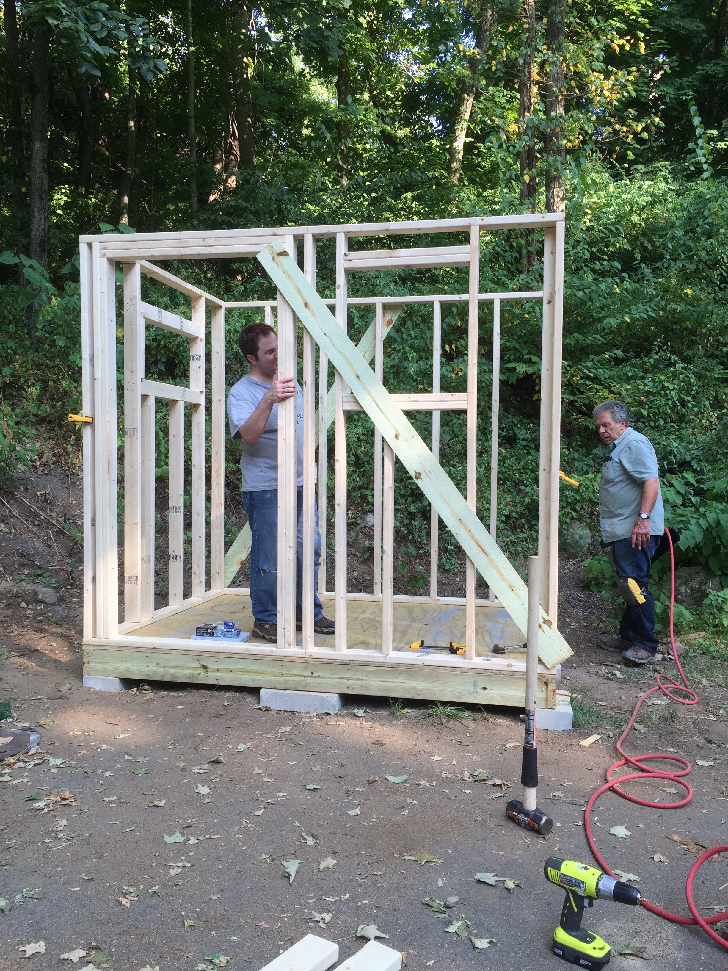 DH helping get the walls up