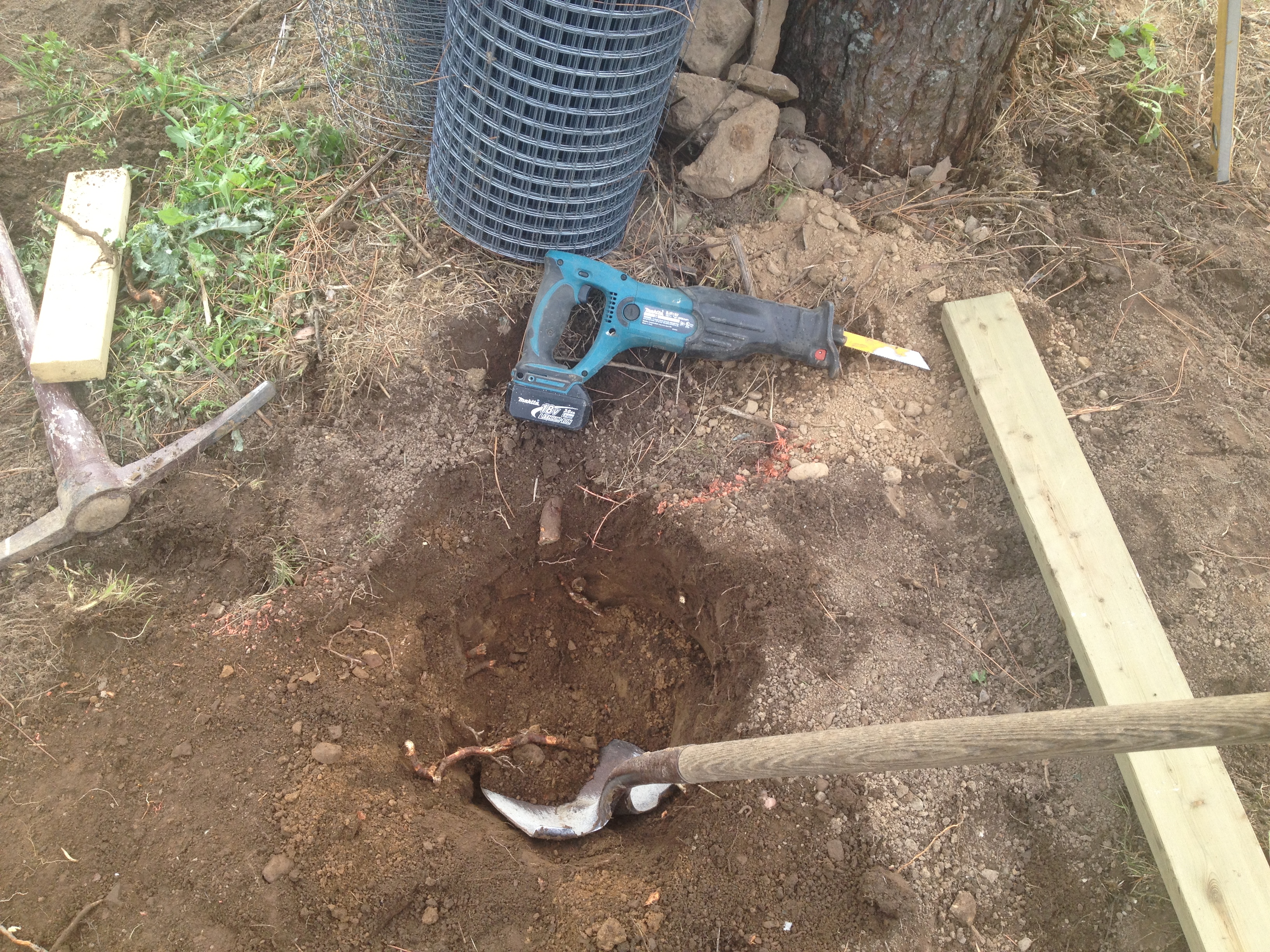 digging the last of the post holes, so all they are all on sitting on bedrock.