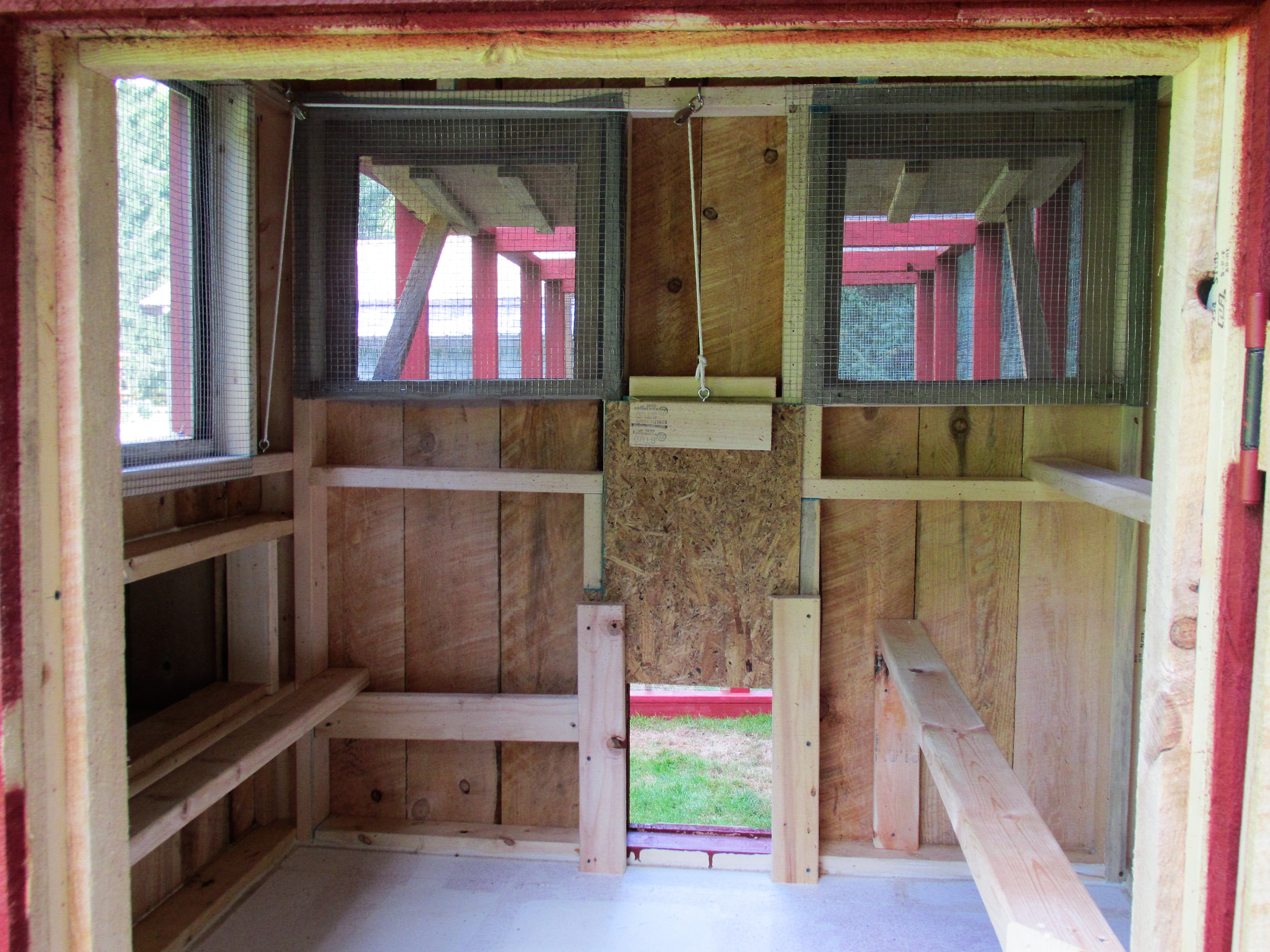 door pulley setup,
 I pull the rope from the outside of the coop. so there is no need to go in the run or coop to open the pop door