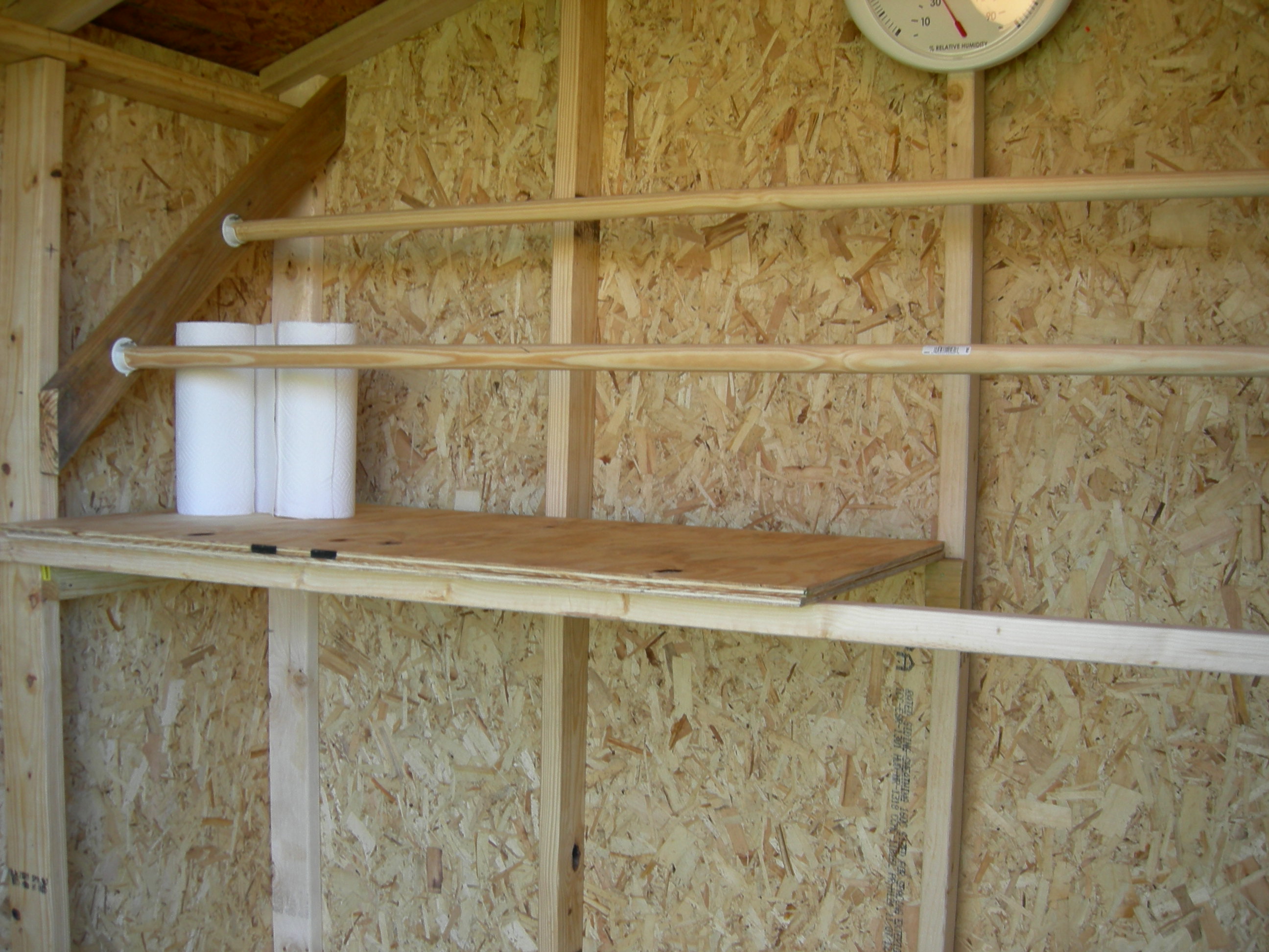 Dropping Boards, one side retracted to make room for brooder box