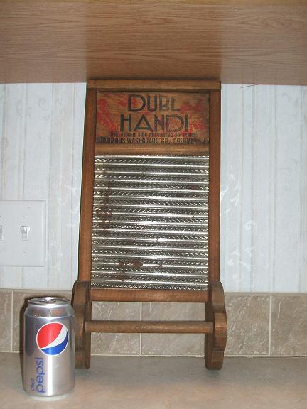 Dubl Handi washboard towel rack
has a little rust, but I think that makes it look better (o:
(looks odd, sorry.  It's between the counter and the bottom of the cabinets)