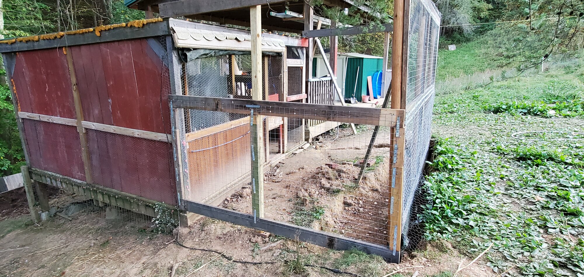 East sidewall is framed and ½ covered in 2x2" welded wire-mesh