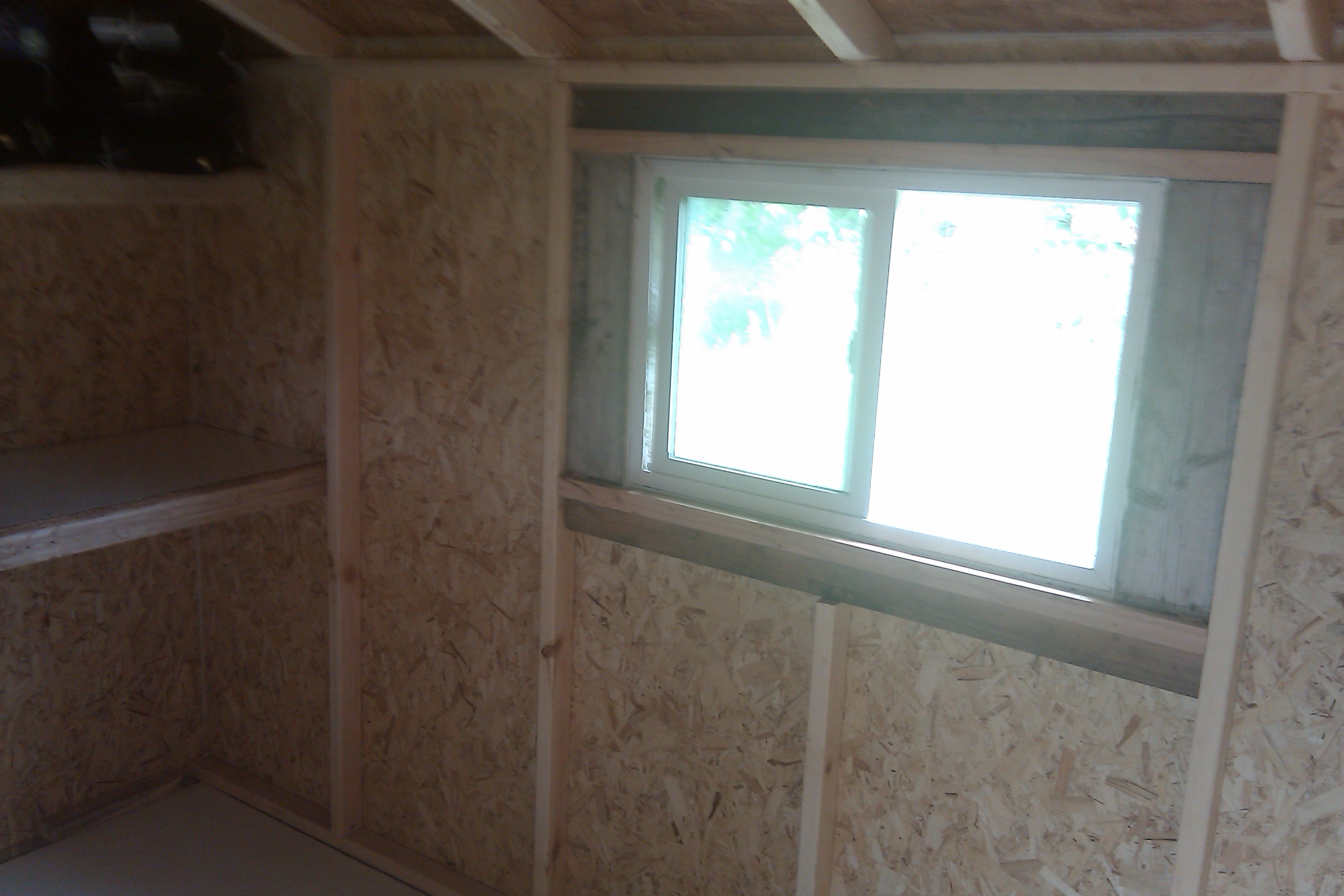 East window, salvaged from a modular home we torn down on the property.  All the lumber for this project, with only a few exceptions, was salvaged from the modular tear down - waste not, want not...