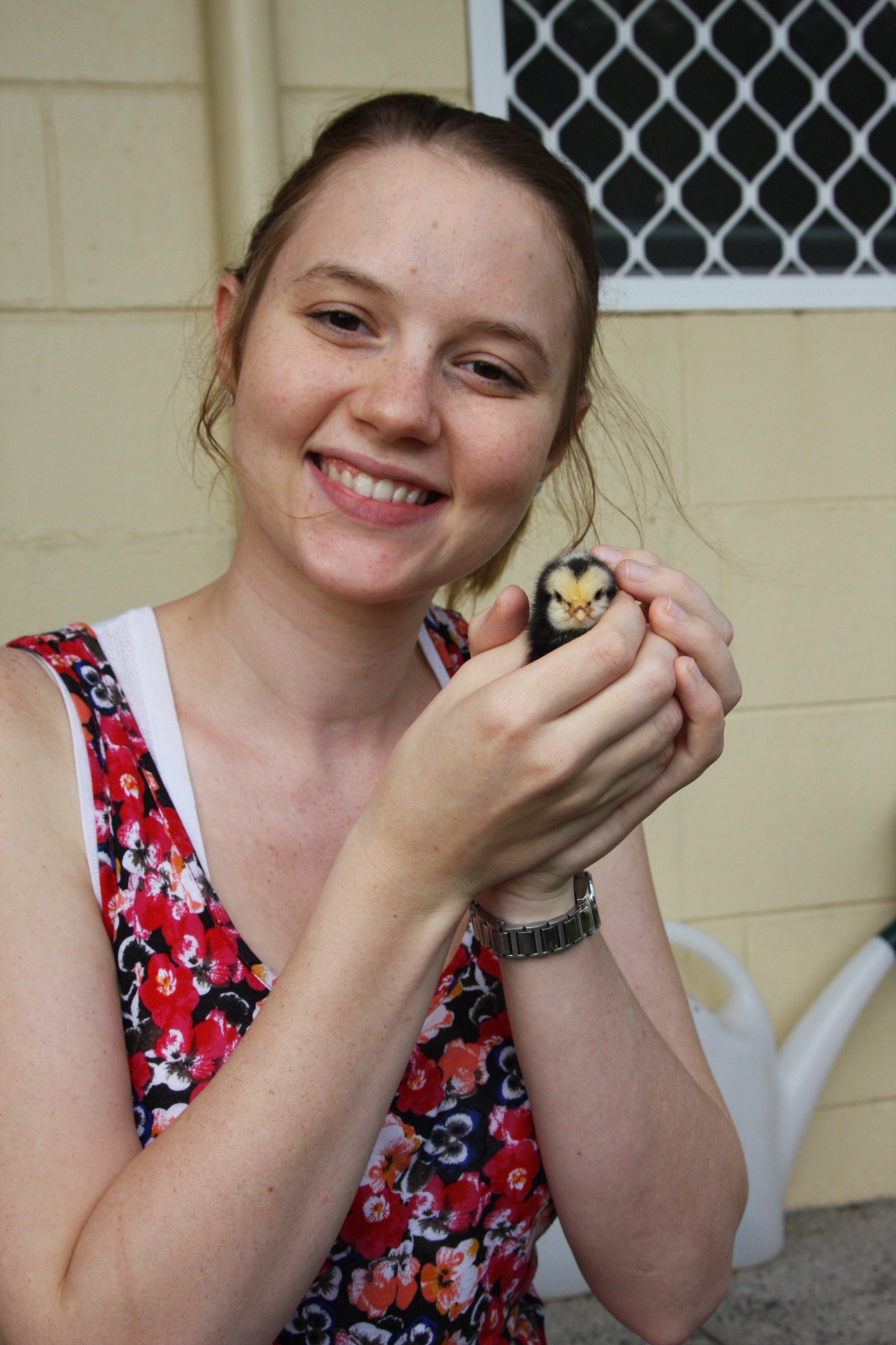Elizabeth and a baby chick.