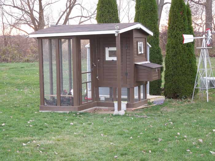 Finally done! Took about a month after getting the chickens to finish all of the trim work/painting/finishing touches. Put up some solar motion sensing security lights on the front and back sides for when we have to run out there at night, and hopefully to scare away any critters that might try to decide to take a closer look.