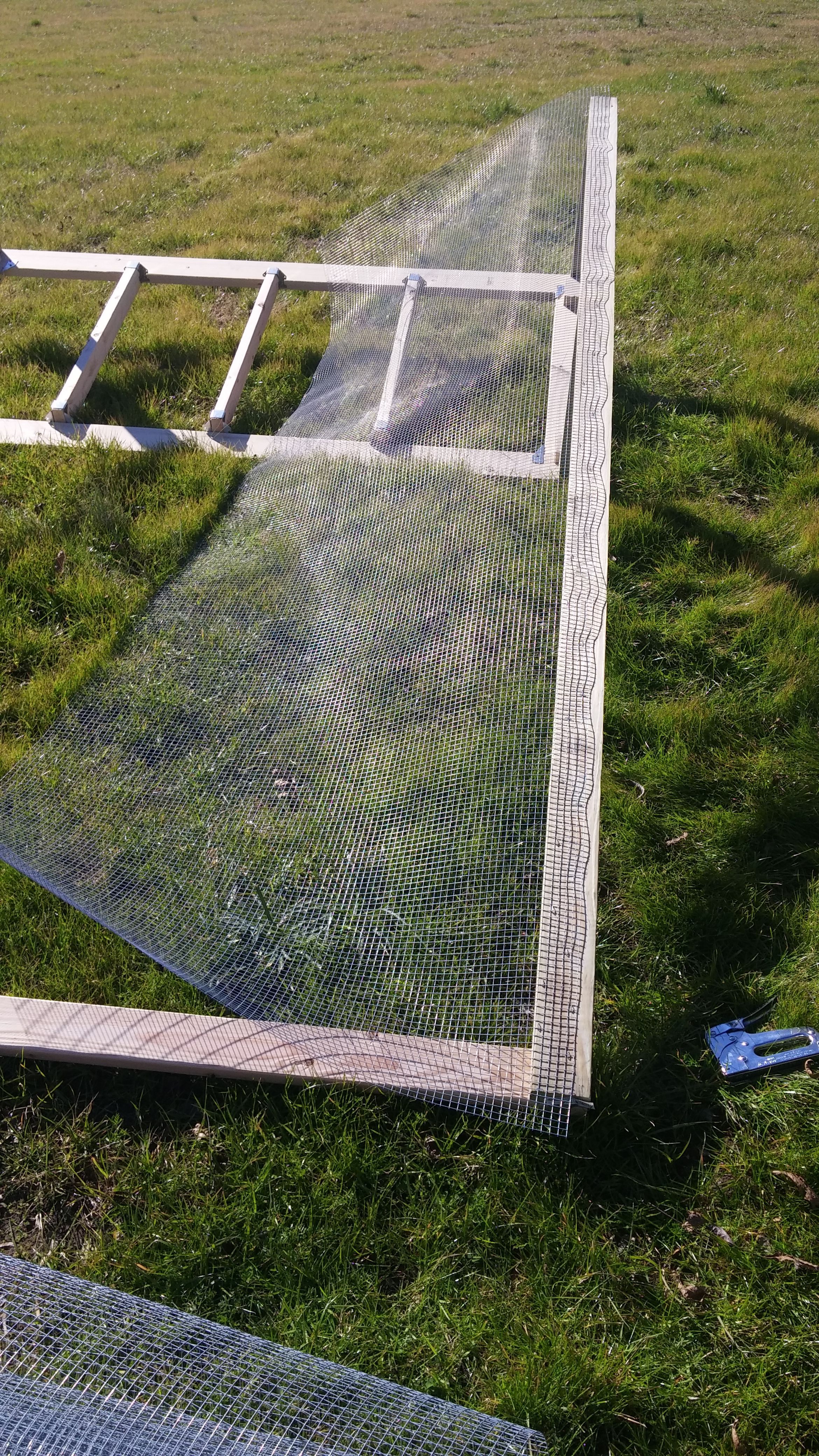 Flipping it upside down to staple on hardware cloth. BackYard