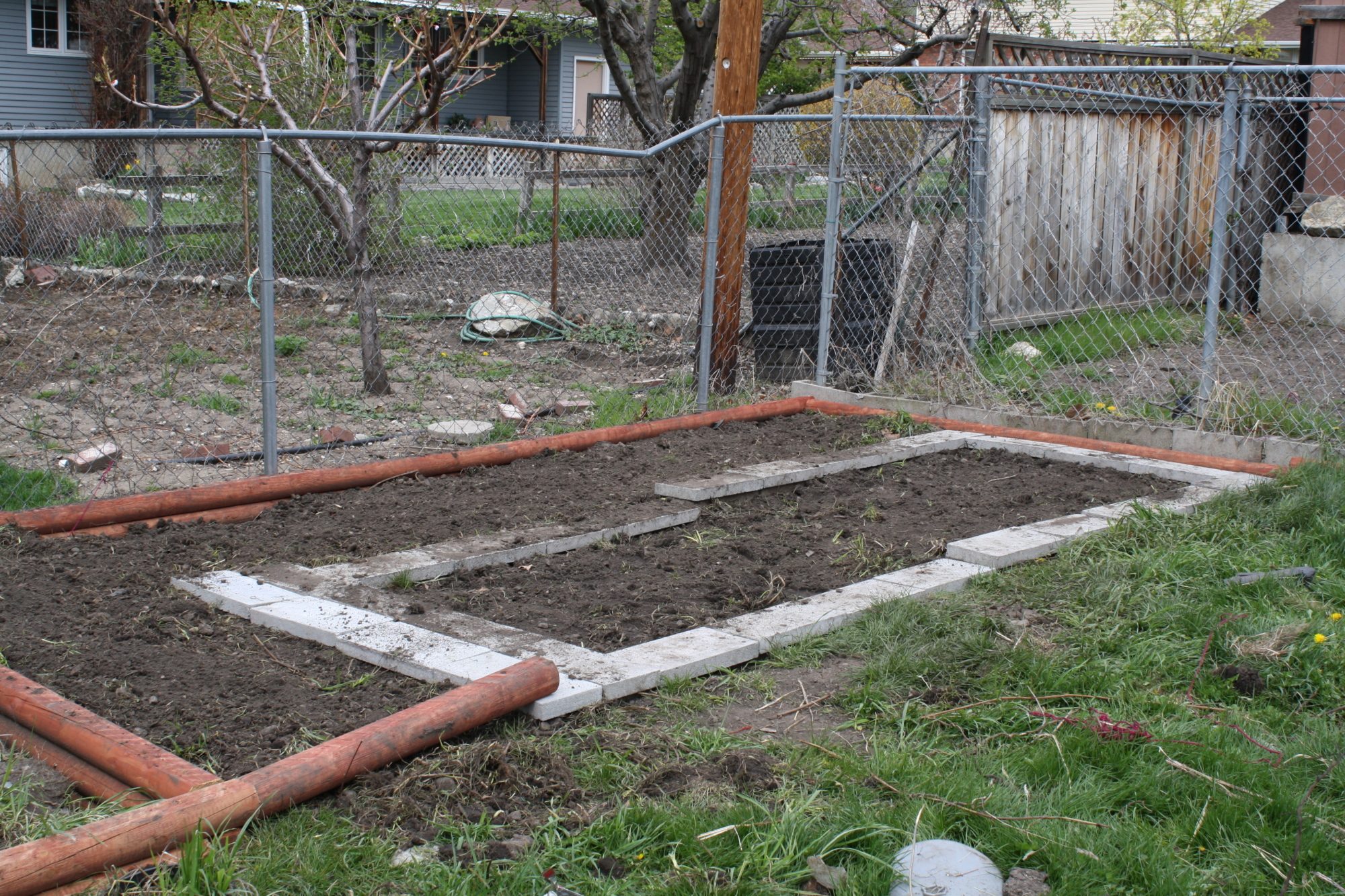 Foundation of buried cinder blocks donated by a coworker with pavers on top.