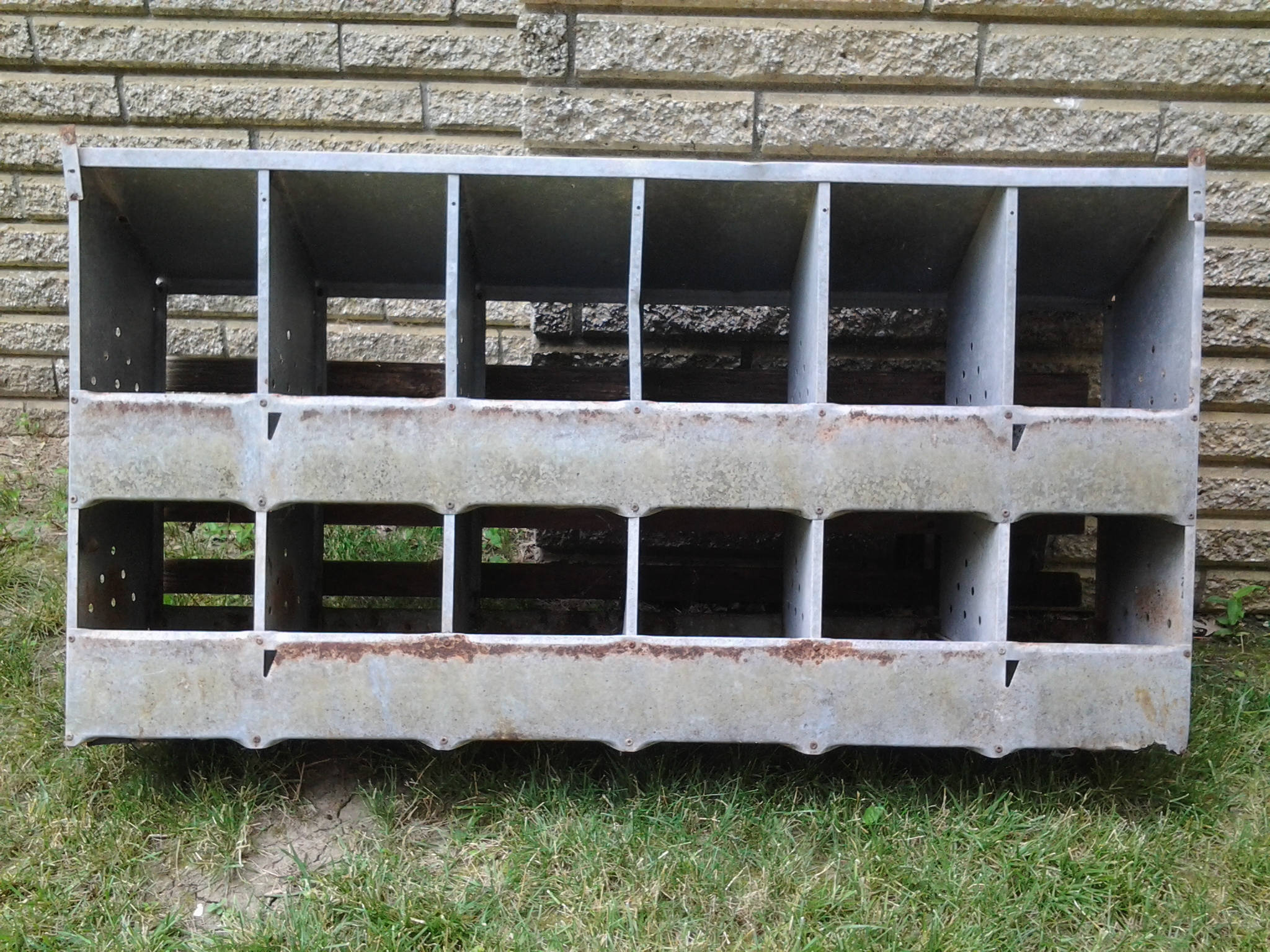 Free metal 12 nest boxes x 2 given to me by my mother.  They need cleaning up and wood on back replaced, but other than that trying to figure out how best to incorporate them.  I do NOT plan on having enough hens to utilize these boxes, so I'm beginning to wonder if they're even worth incorporating....

Front side view