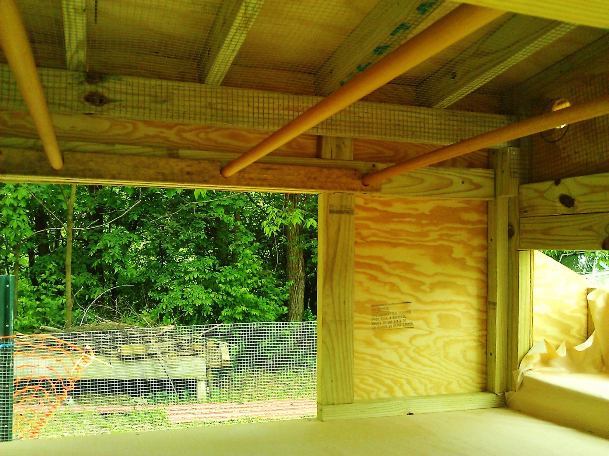 front and back doors are 2ft x 3ft long to clean out, back door has wood cut out and attached to the door to be able to sweep/hose out, floor is sloped.