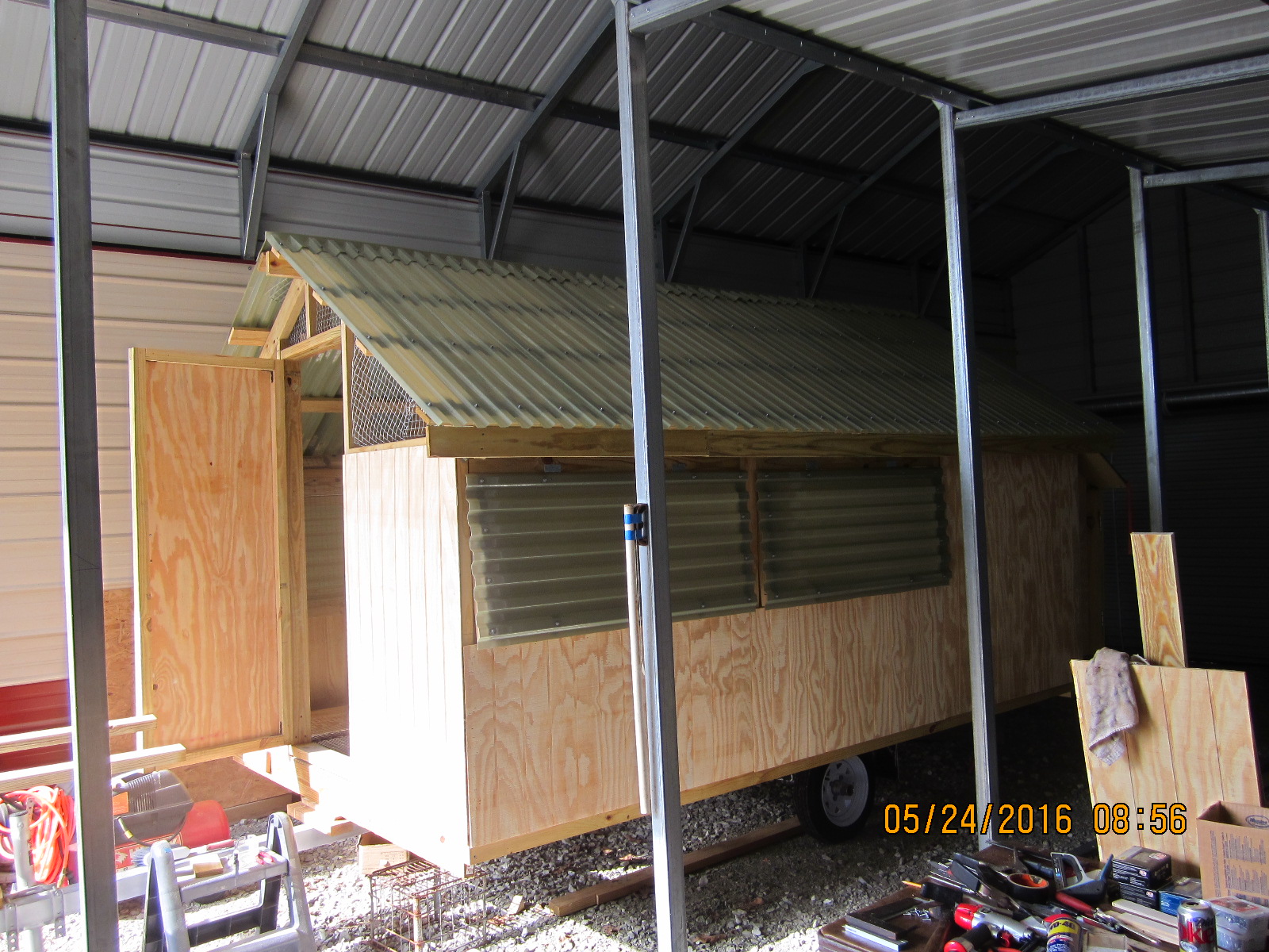 Front door and window covering with polycarbonate awnings.