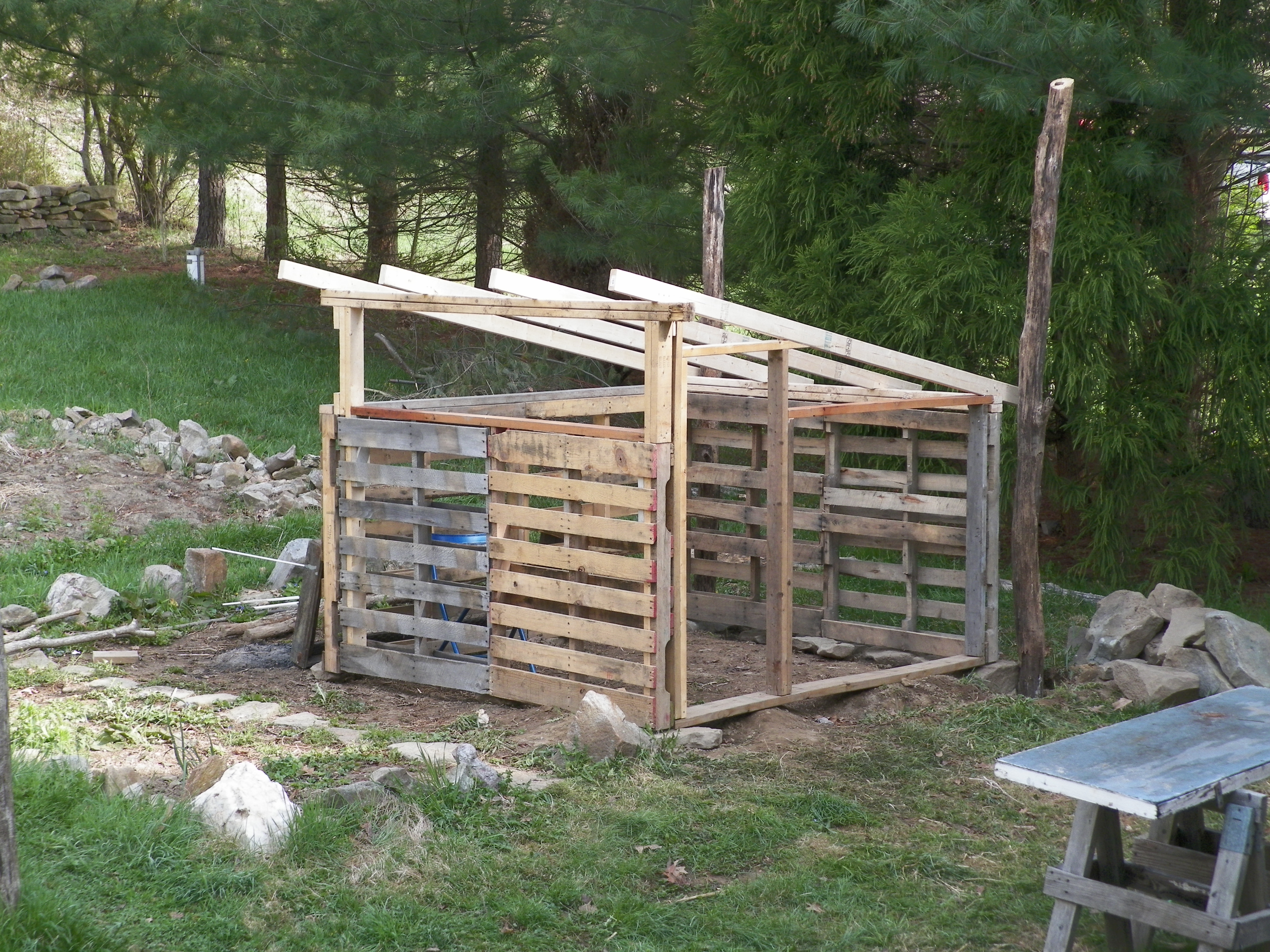 Front framing and roof rafter in place. Some of the only new lumber we bought were these long 2x4s for the roof.