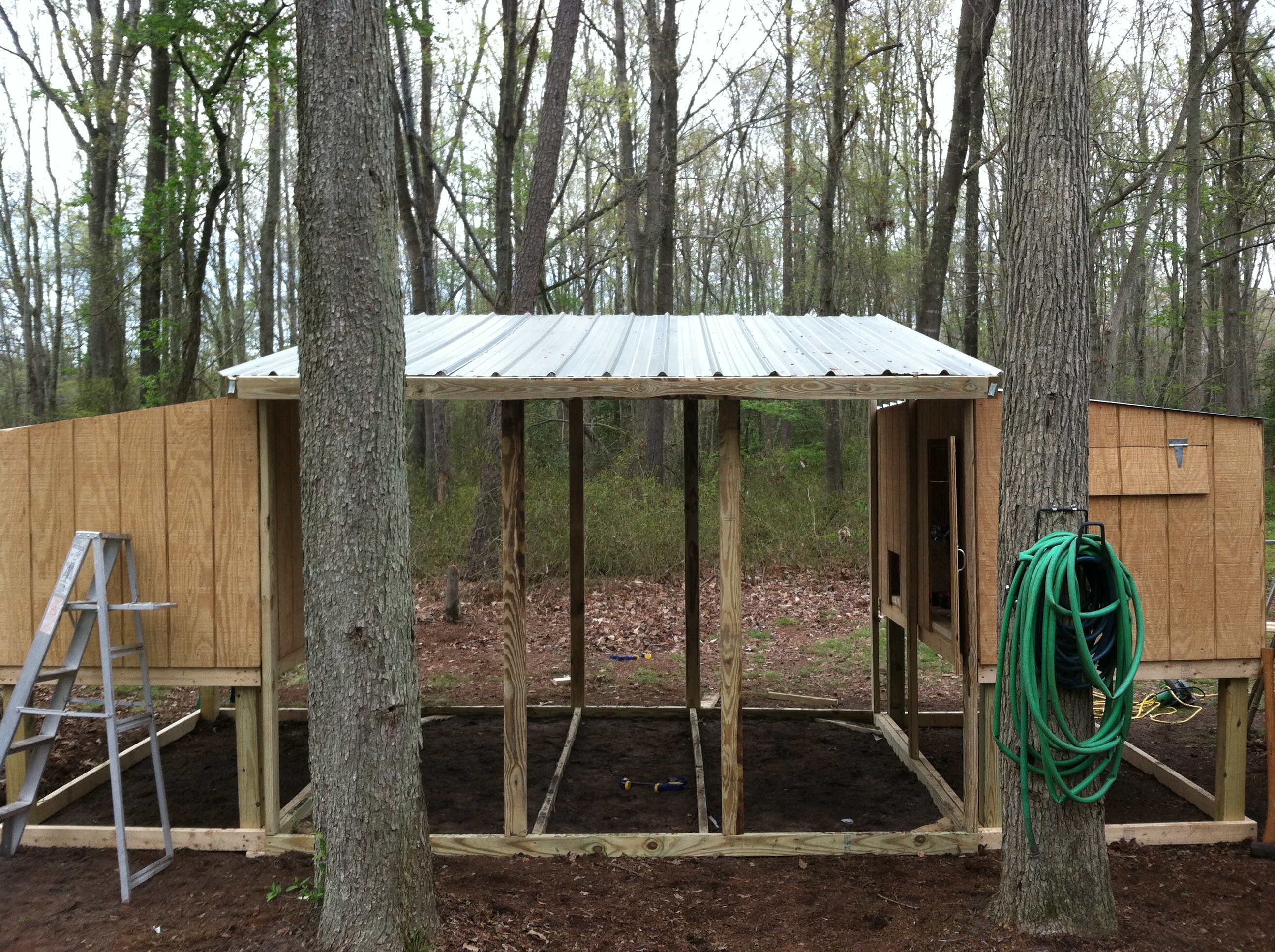 Front view. Sorry about the trees in the way.
Contemplating putting a gutter across the front to collect rain water.