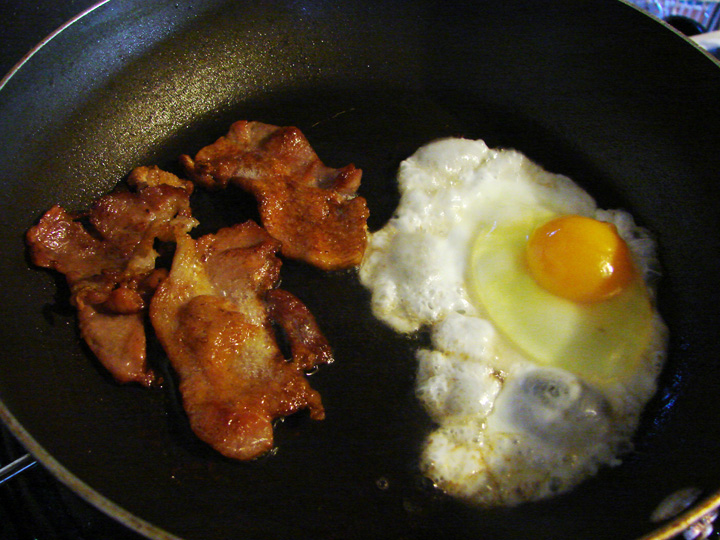Frying up the first egg.  I tried to get a view that would show how high the yolk and white were standing.