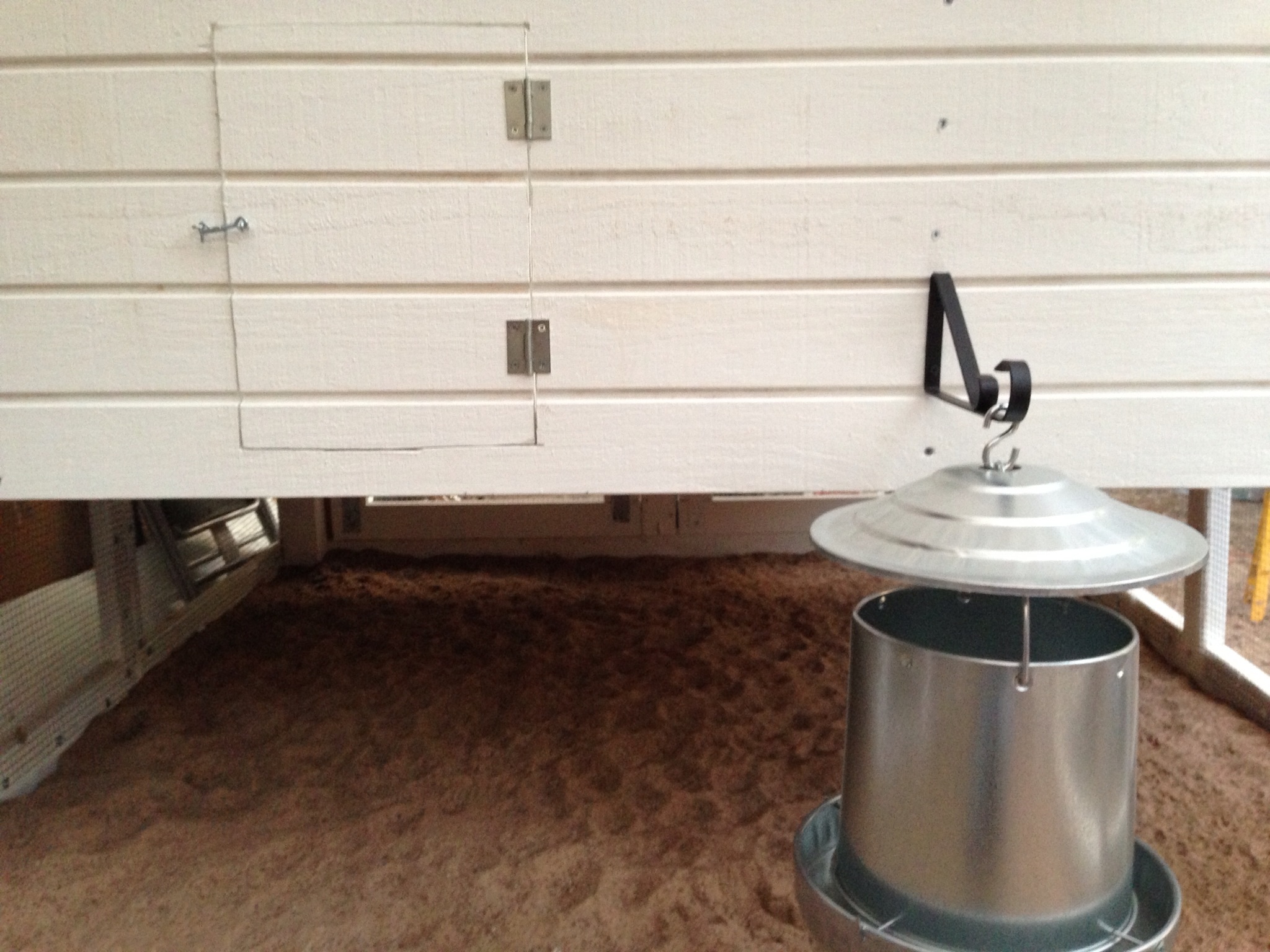 galvanized feeder with cover--close enough to the door to the run the it'll be easy to refill