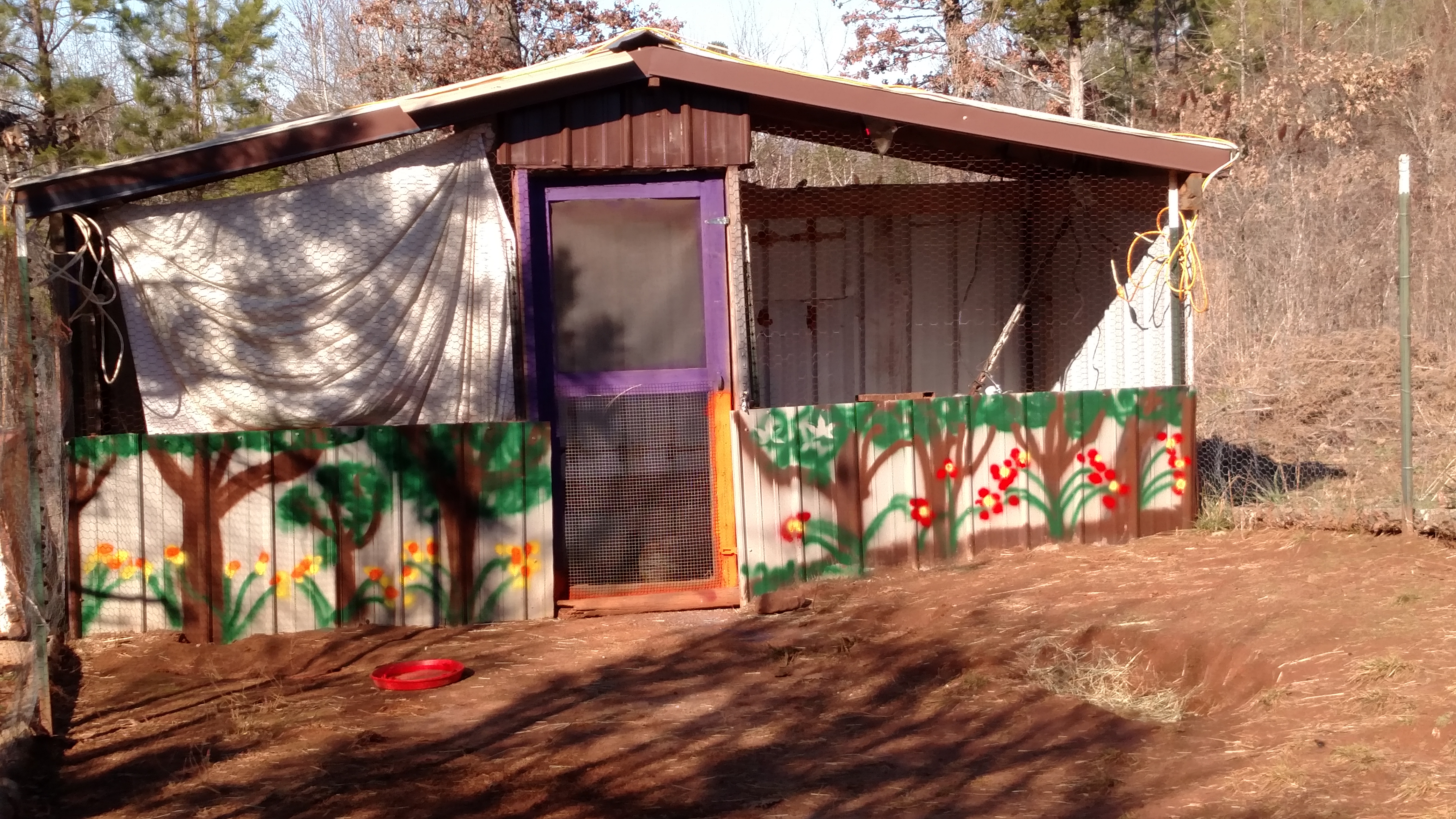 Got to looking around on site.  Sure gives me lots of ideas.  And for sure gave me energy to clean up mine and paint front.  Compost distributed around garden perimeter.  And compost from sick birds in burn pile.