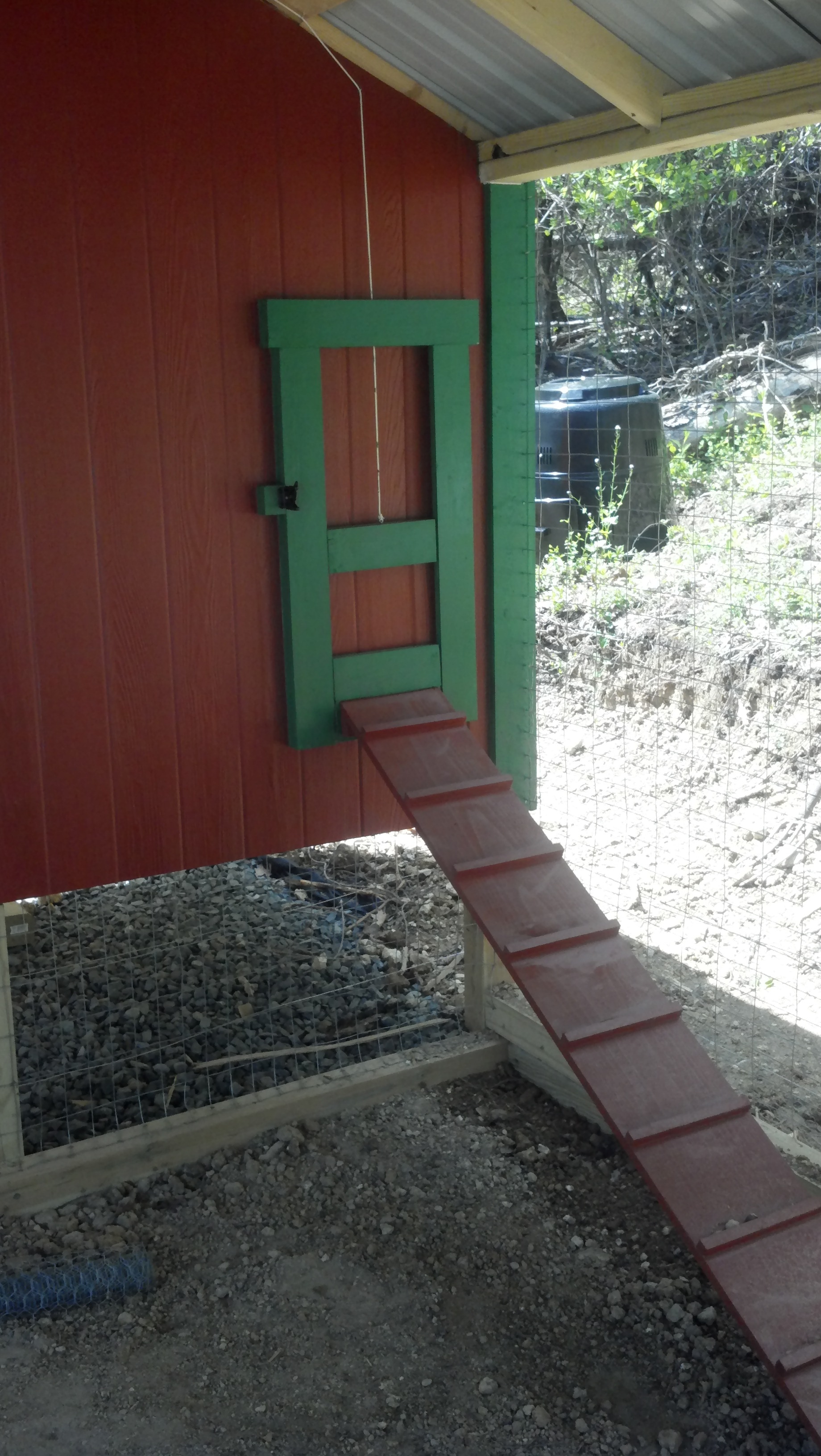 Guillotine door with ramp and you can see the compost bin in the background.