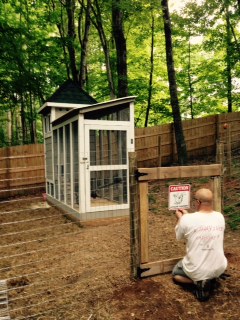 Hanging the "Danger, Attack Chickens" sign.