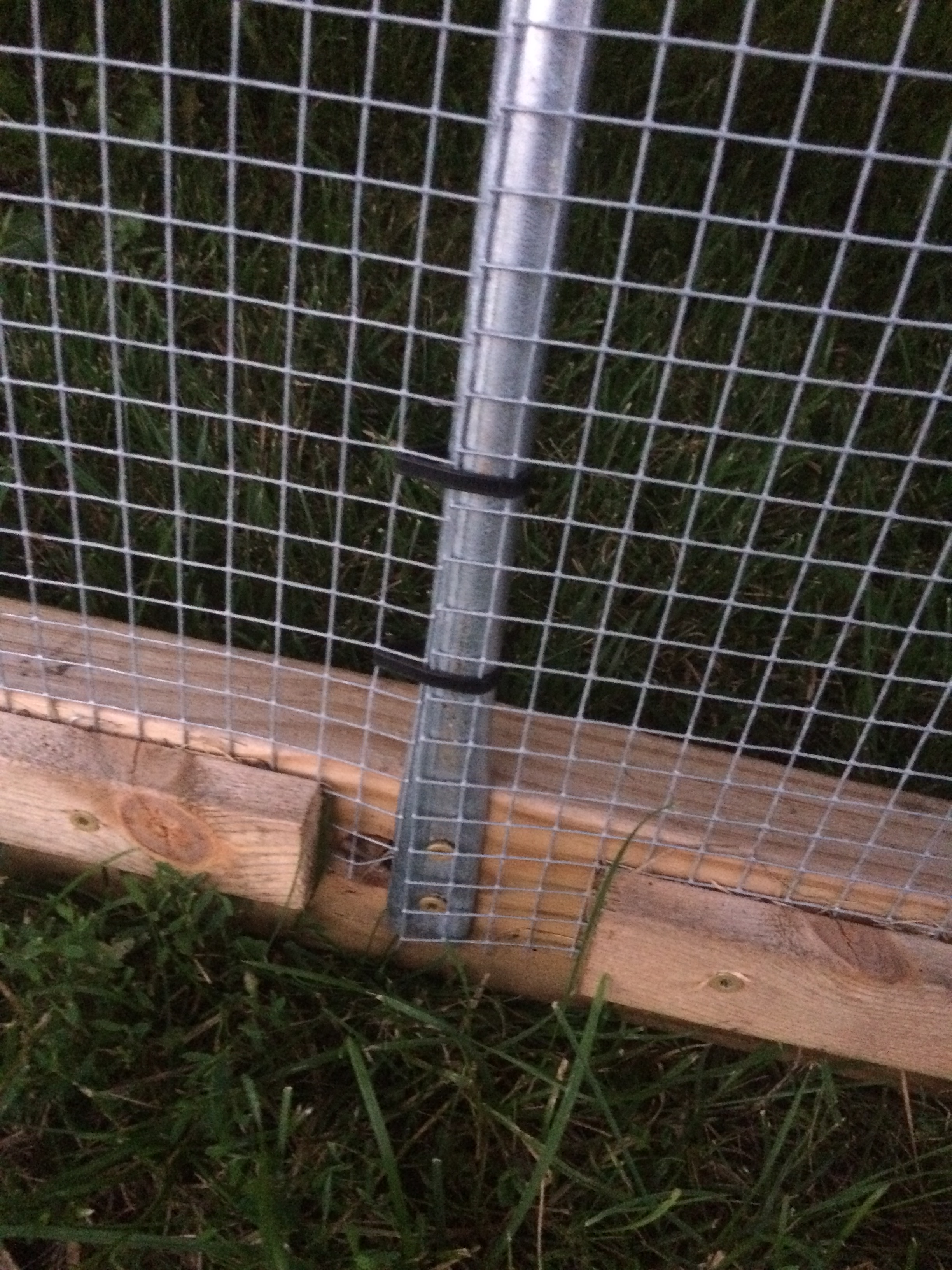 Hardware cloth is overlapped by one square then ziptied to the conduit.  I put several close together at the base and space them out further towards the top.  If you had a heavy predator load, i would put many zipties on.