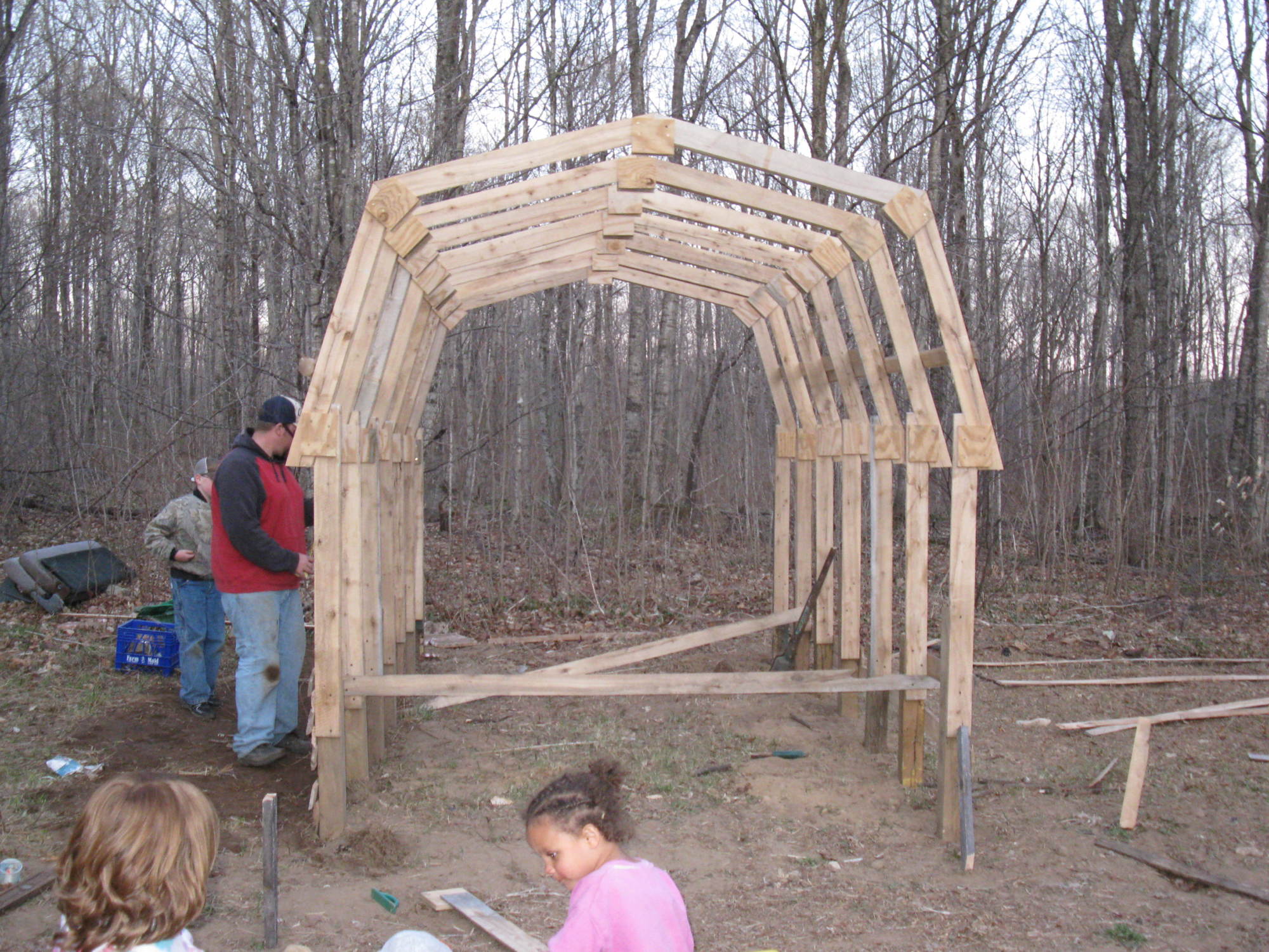 Hardwood ribs, plywood gussets, treated 4x4 2' in ground.