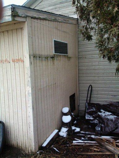 Hen door and one of the mesh covered storm windows