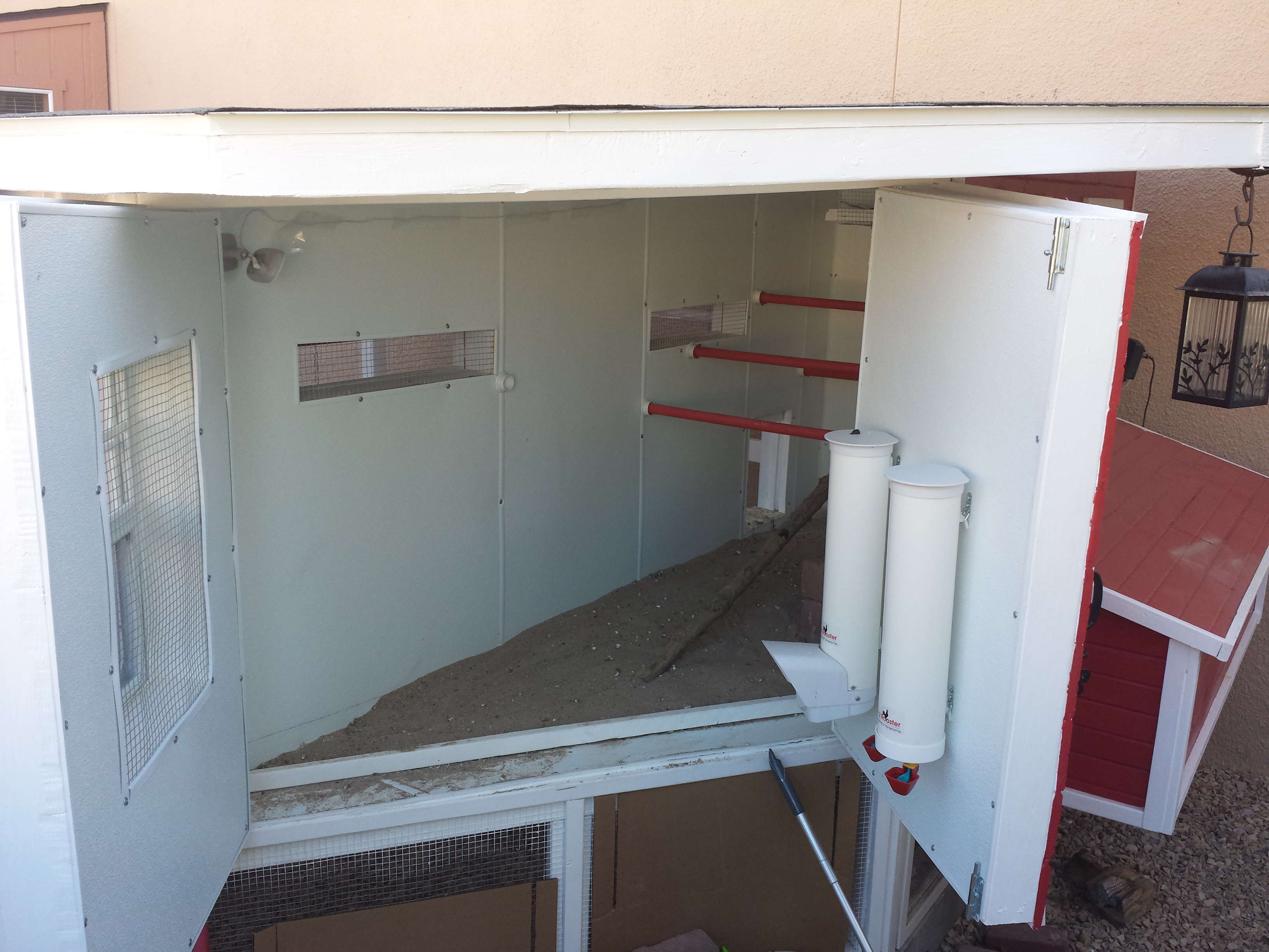 Hen House Doors. I installed a feeder and waterer on one of the doors for easy access to fill and clean