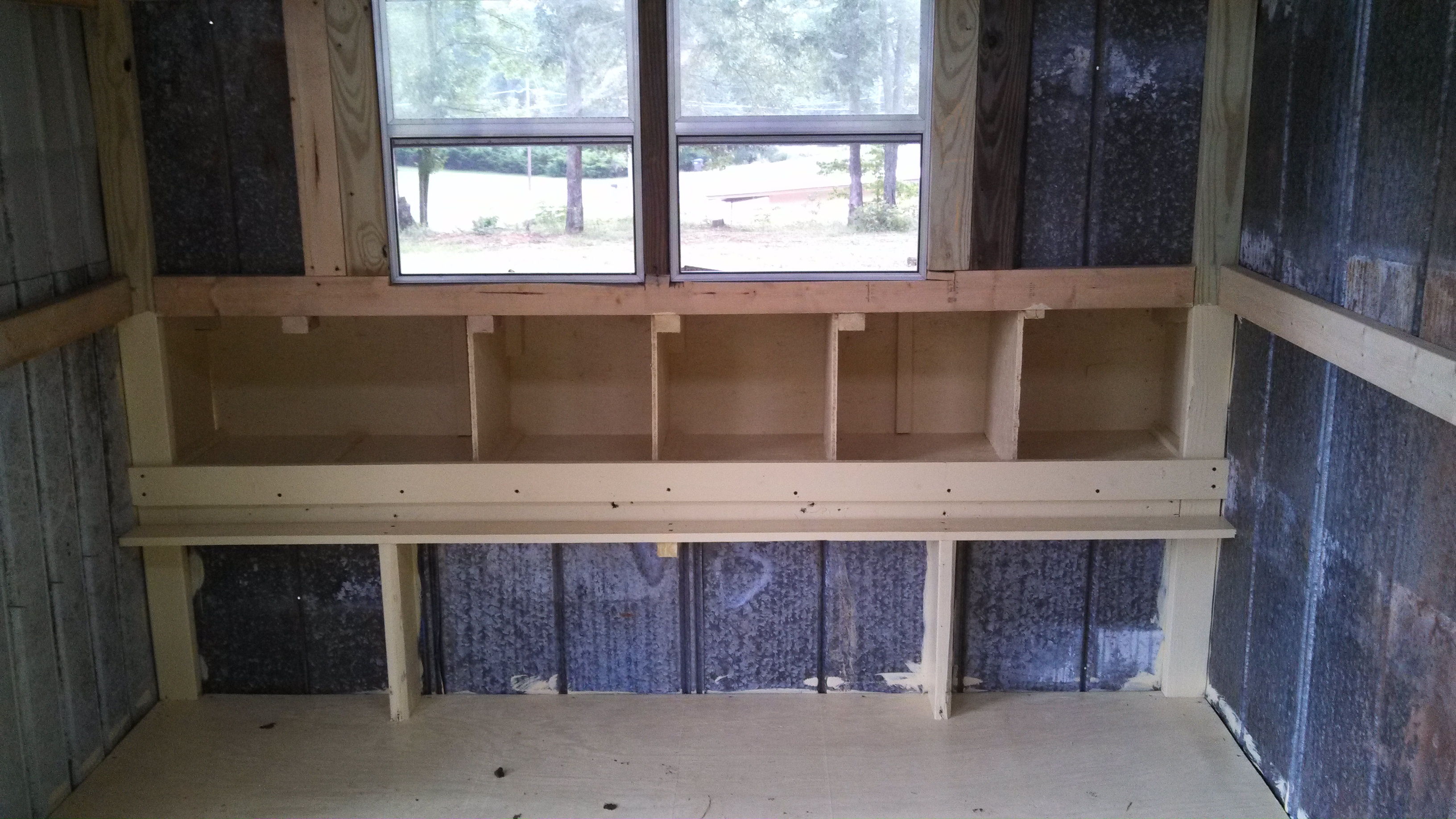Here are the nesting boxes built and painted except for one divider, I have to make another trip to the hardware store.