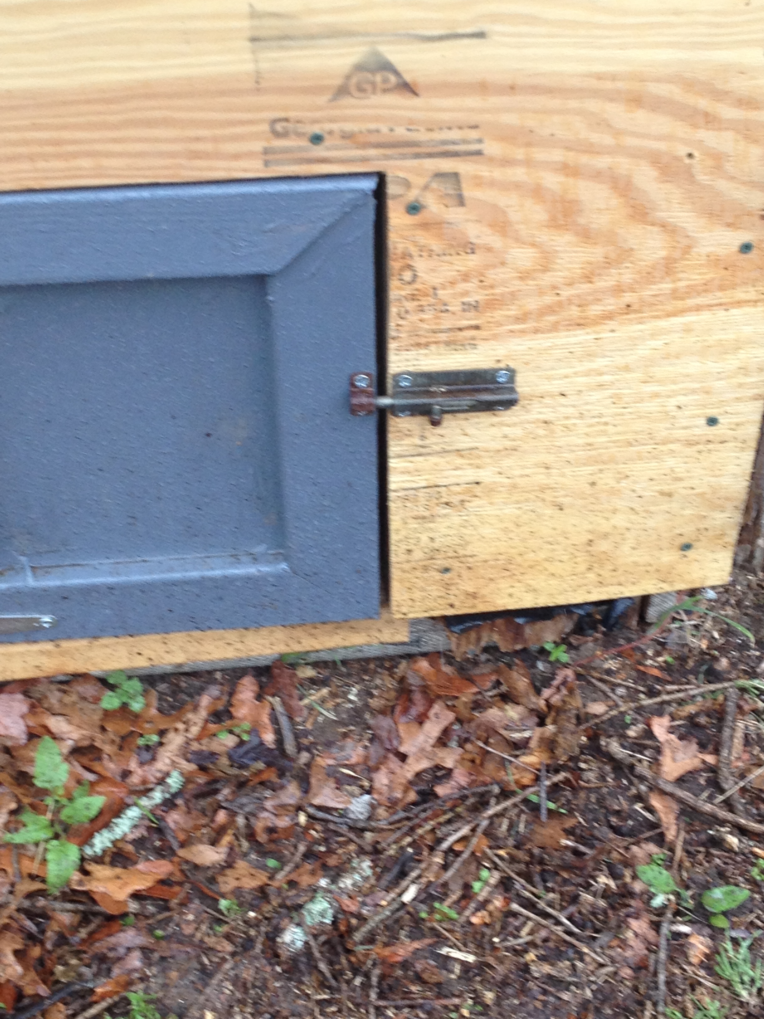 Here is the "chicken door" with new door, new plywood facing, and re purposed barrel bolt. I got rained out before I could move the chickens into the coop, but this would have been the day except for the rain.