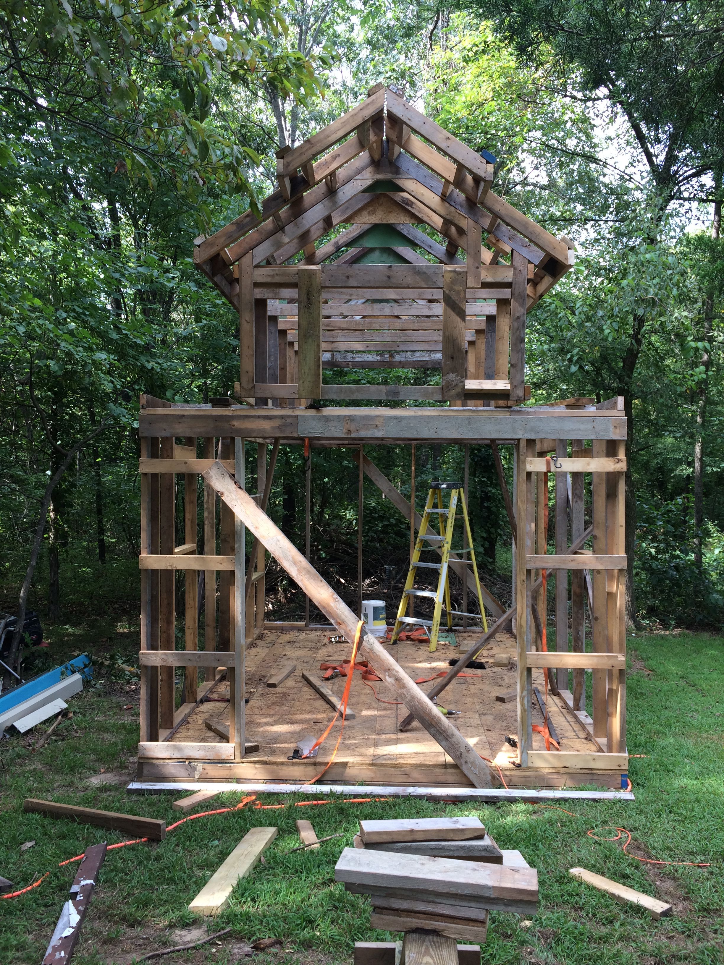 Here we begin to see what it will look like. The center section on top will be used to store hay for the winter.