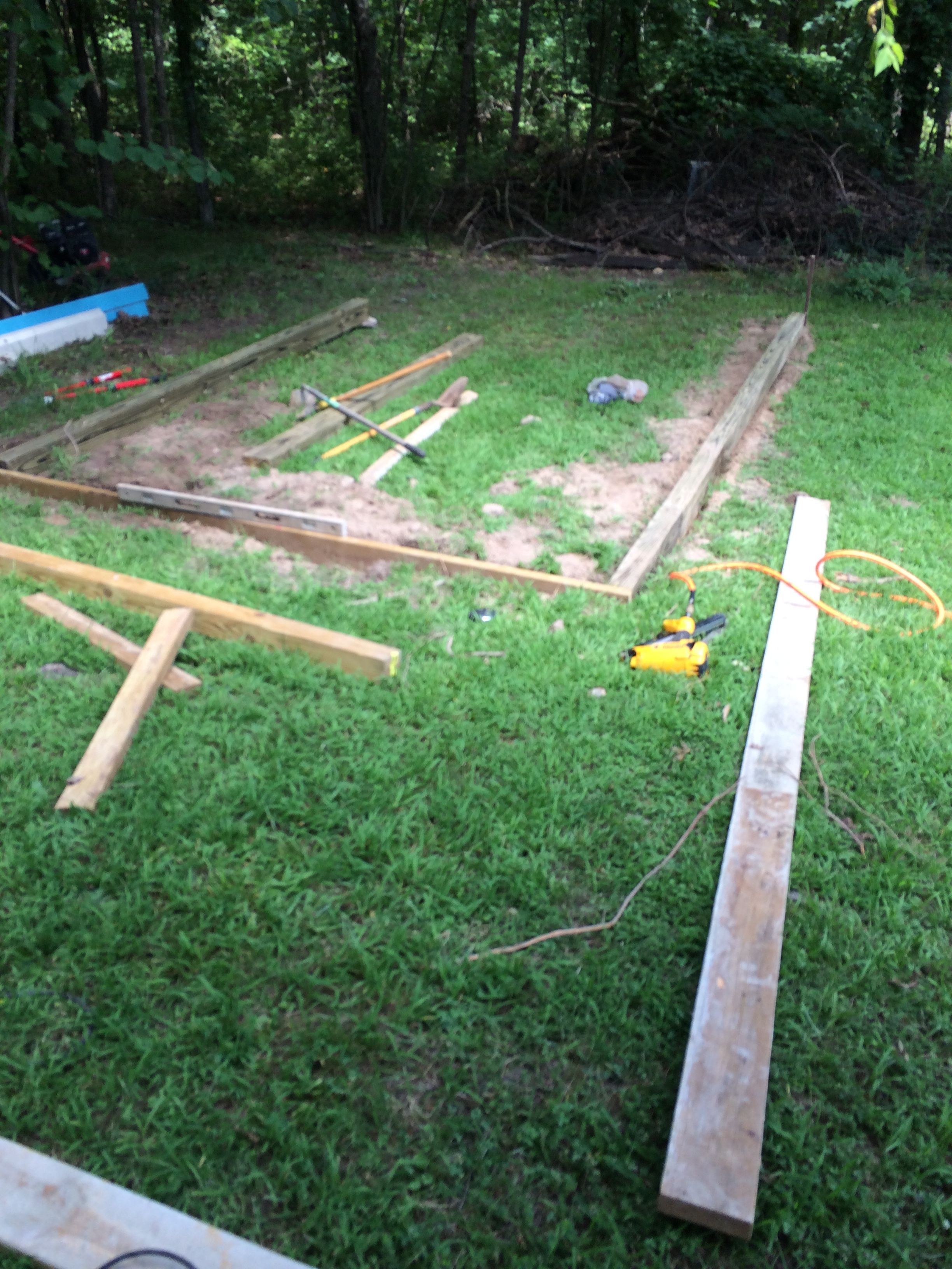 Here we have the 4'x6 pressure treated beams and PT 2x6's for the ends. I buried it in the ground to get it level as well as help keep critters from getting under it.