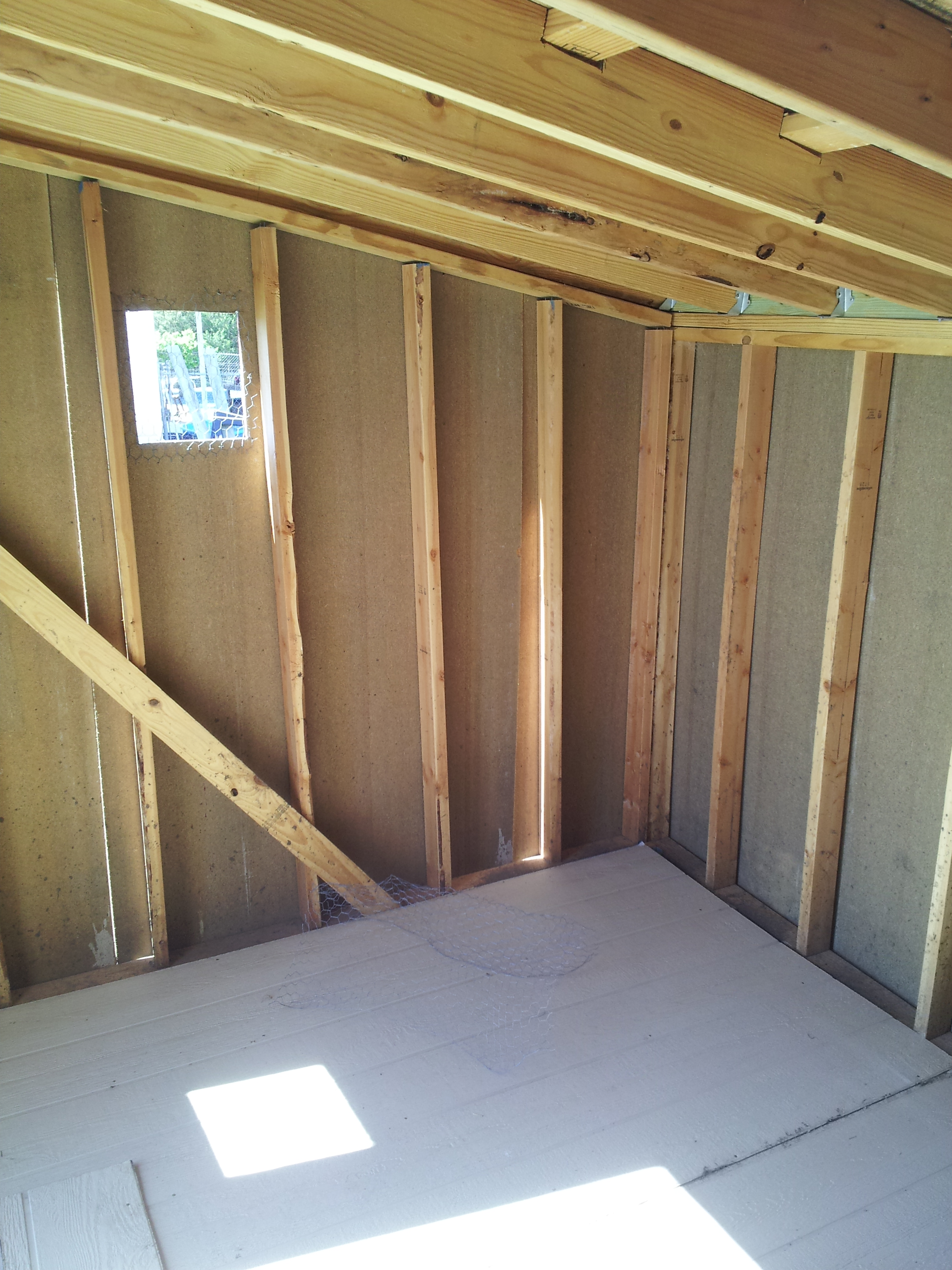 Here's a view of the inside after the floor was installed.  I'll probably have to cut more windows in it as the weather heats up.