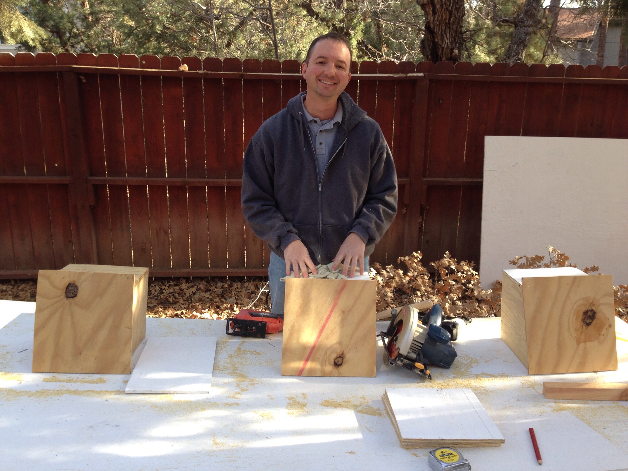 Hubby about to fasten the lids that would go on top of the nest boxes